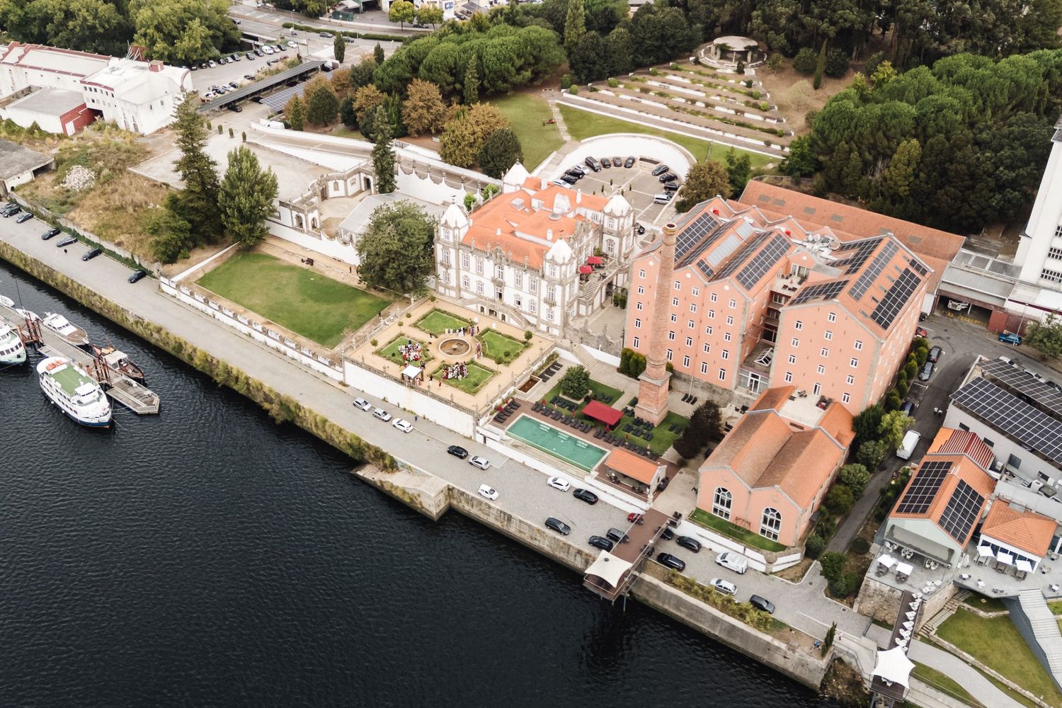 Aerial view of a coastal town with historic buildings and waterfront.