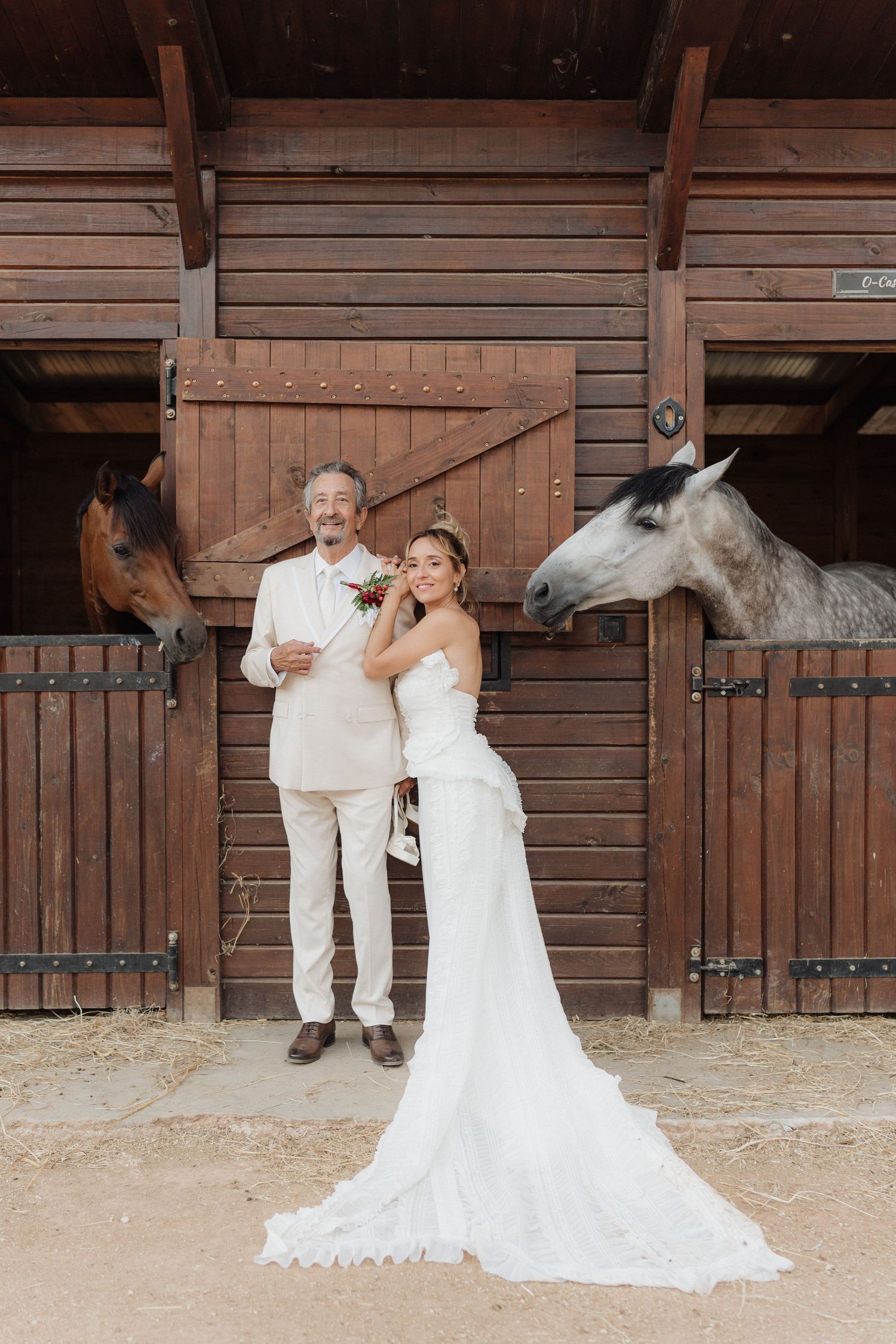 A series of artistic wedding photos featuring a couple posing against rustic wooden barn doors.