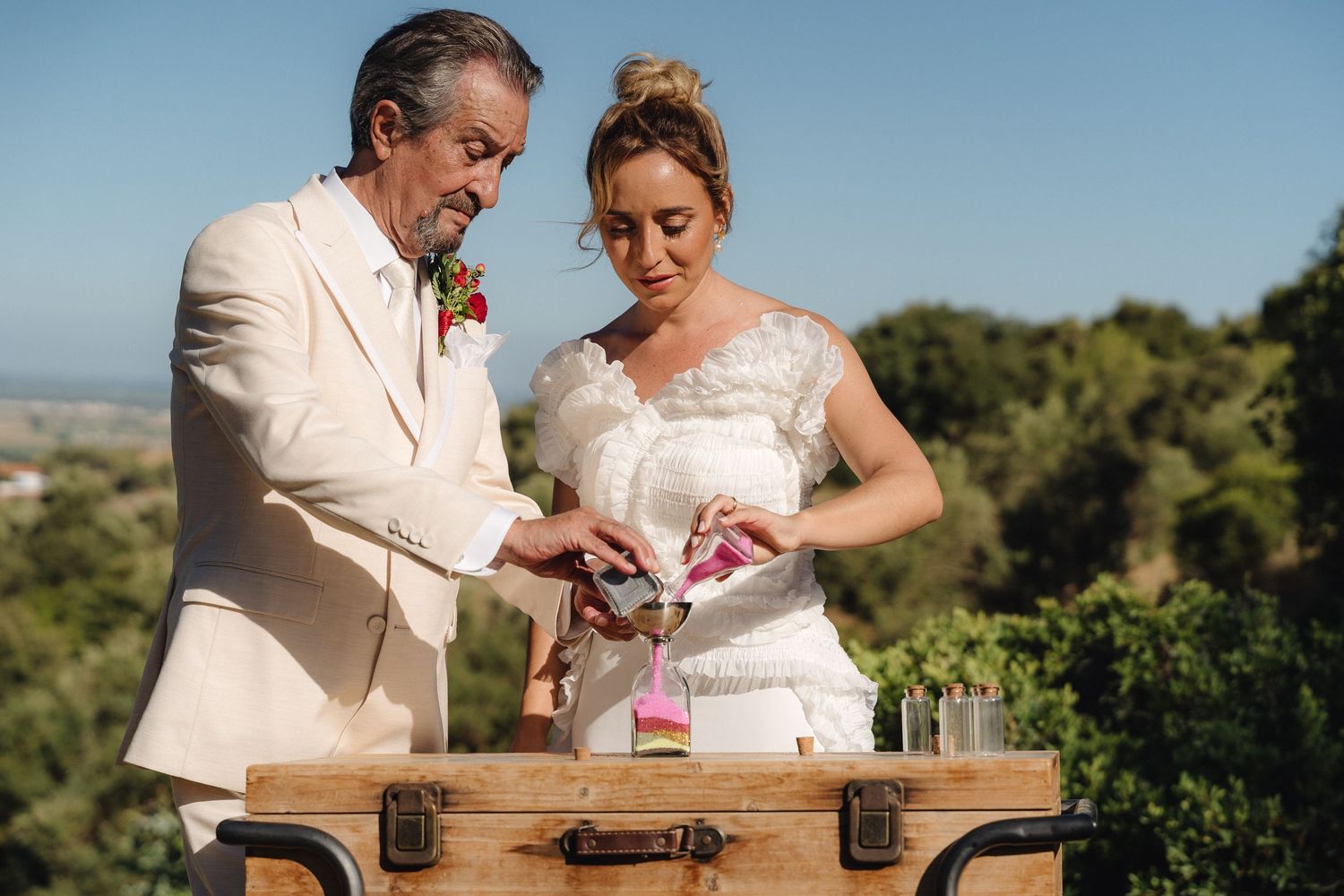 Couple shares intimate moments during outdoor wedding photoshoot.