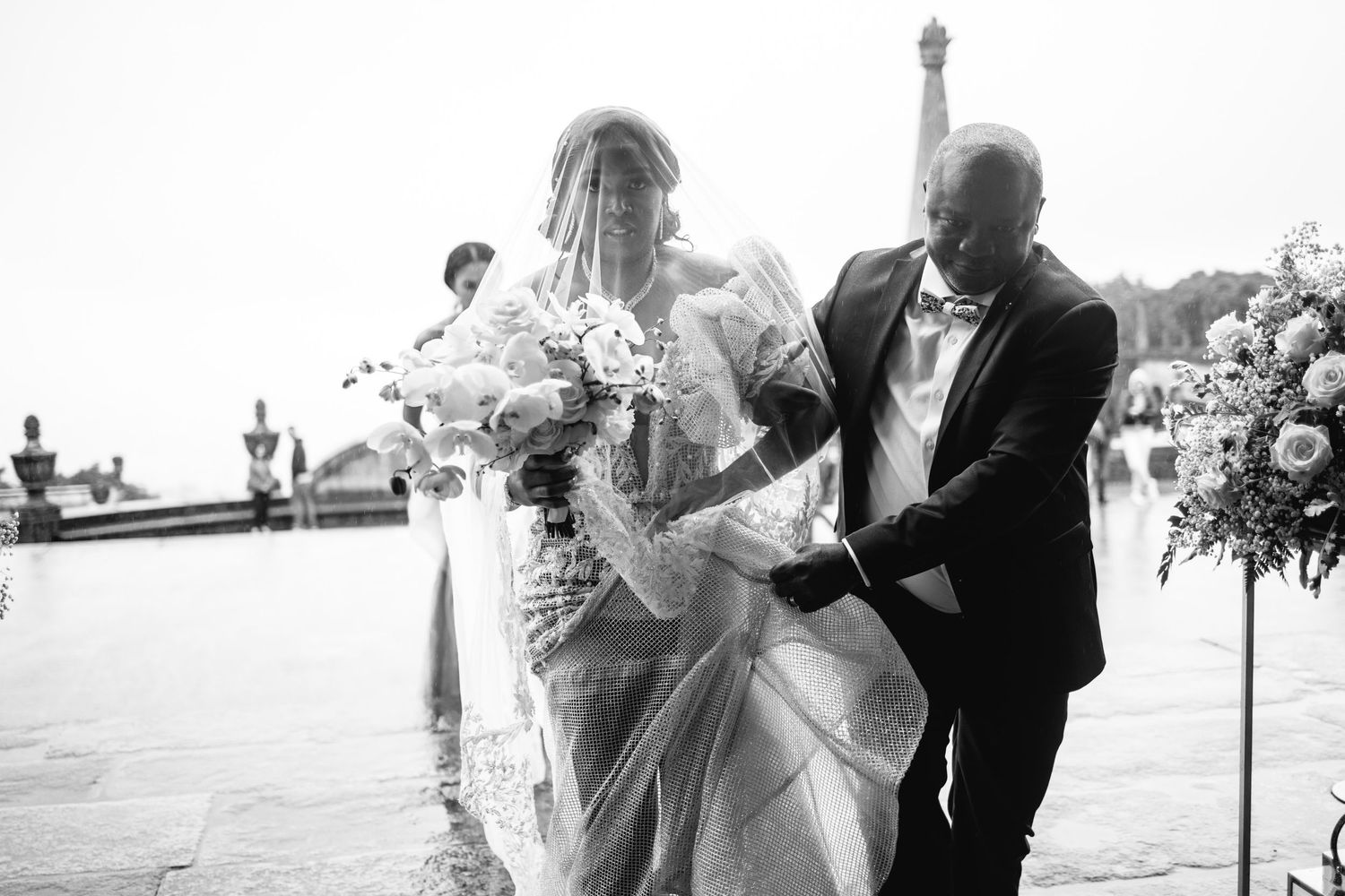 Outdoor wedding ceremony moments captured in black and white photography.