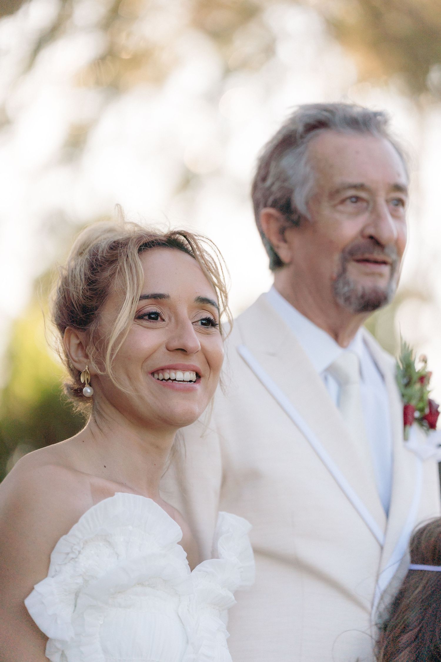 A joyful wedding celebration moment captured in natural outdoor lighting.