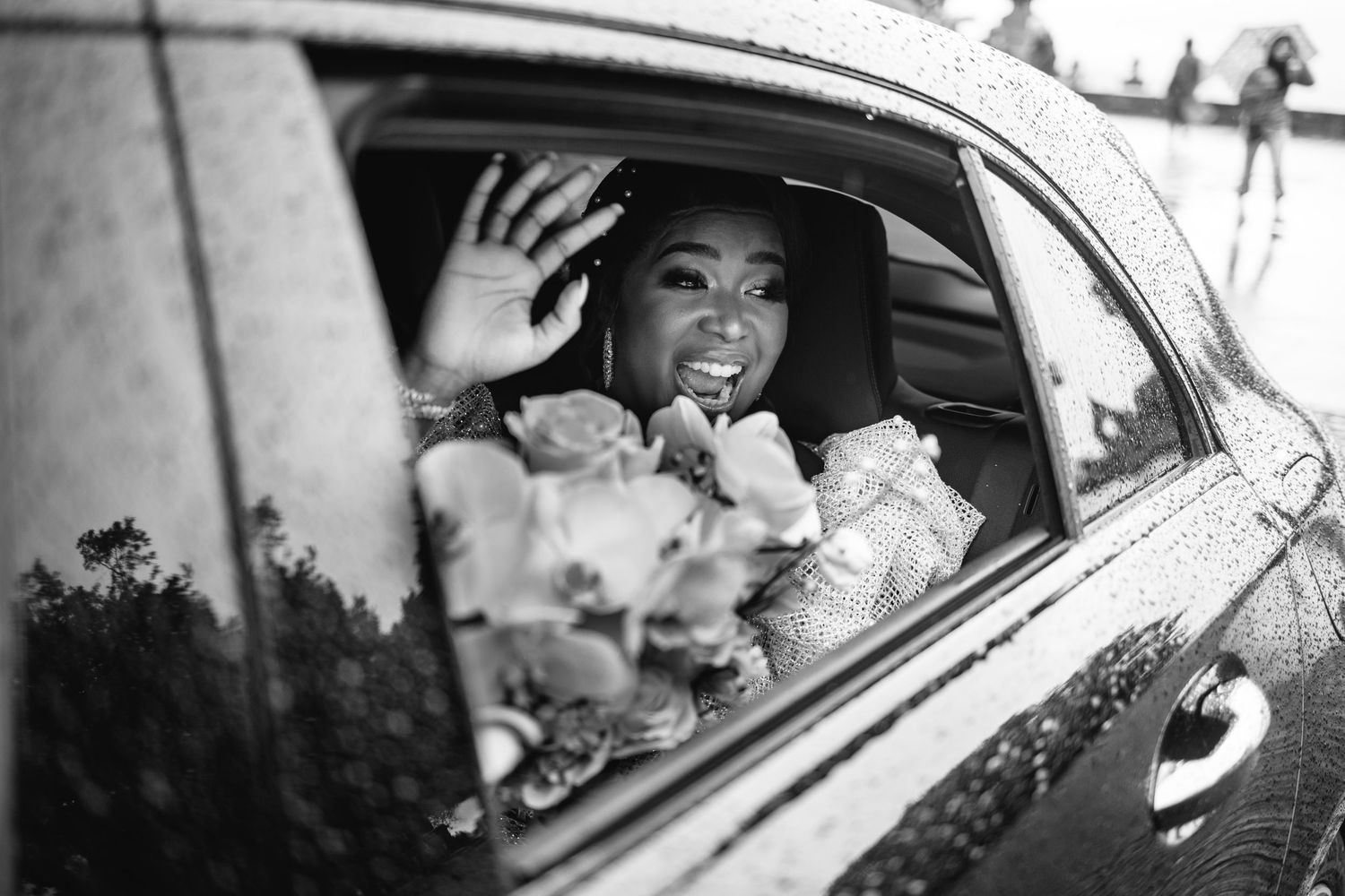 Wedding car decorated with flowers and ribbons awaiting the newlyweds.