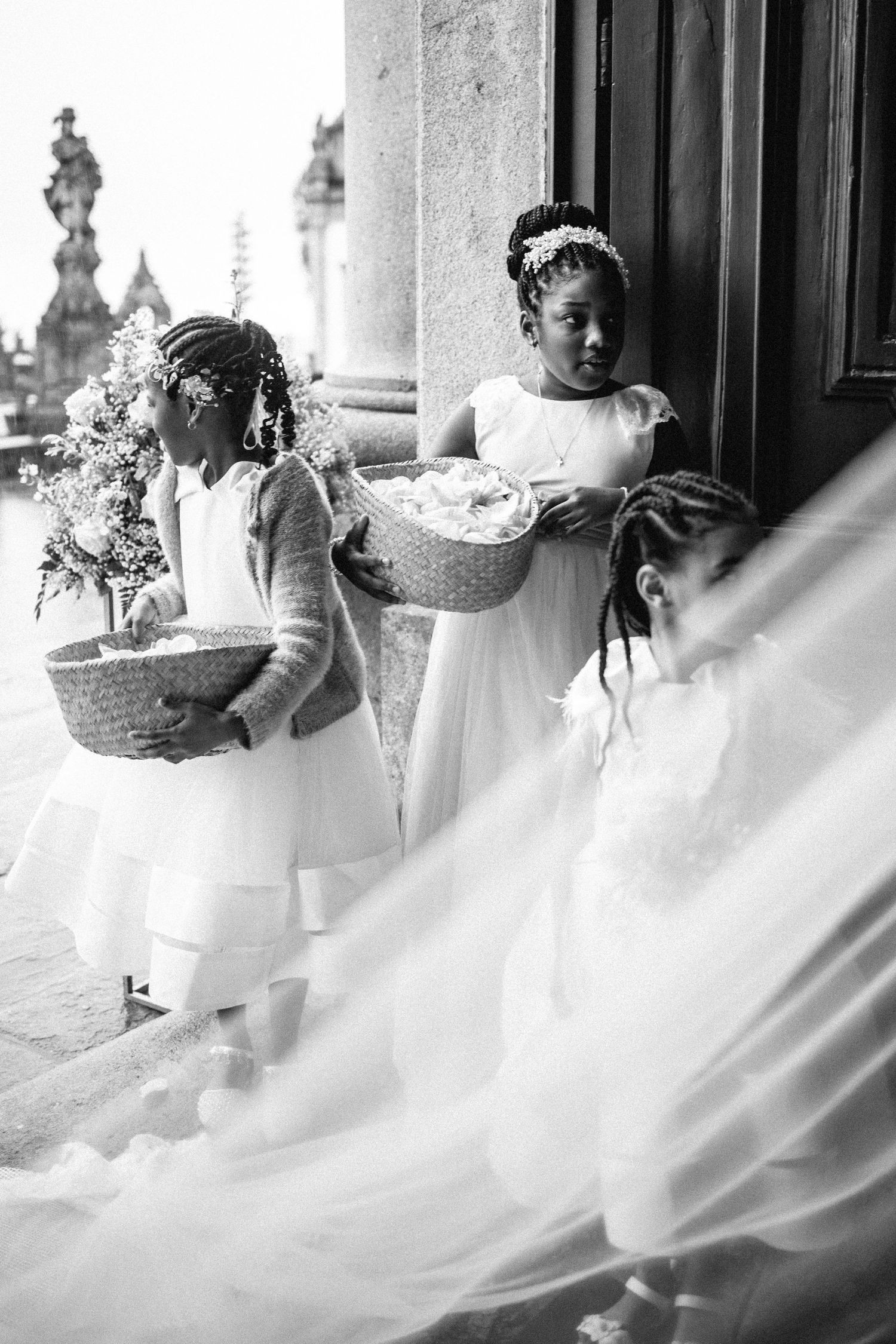 A flowing white wedding dress twirls elegantly in a series of artistic black and white photographs.