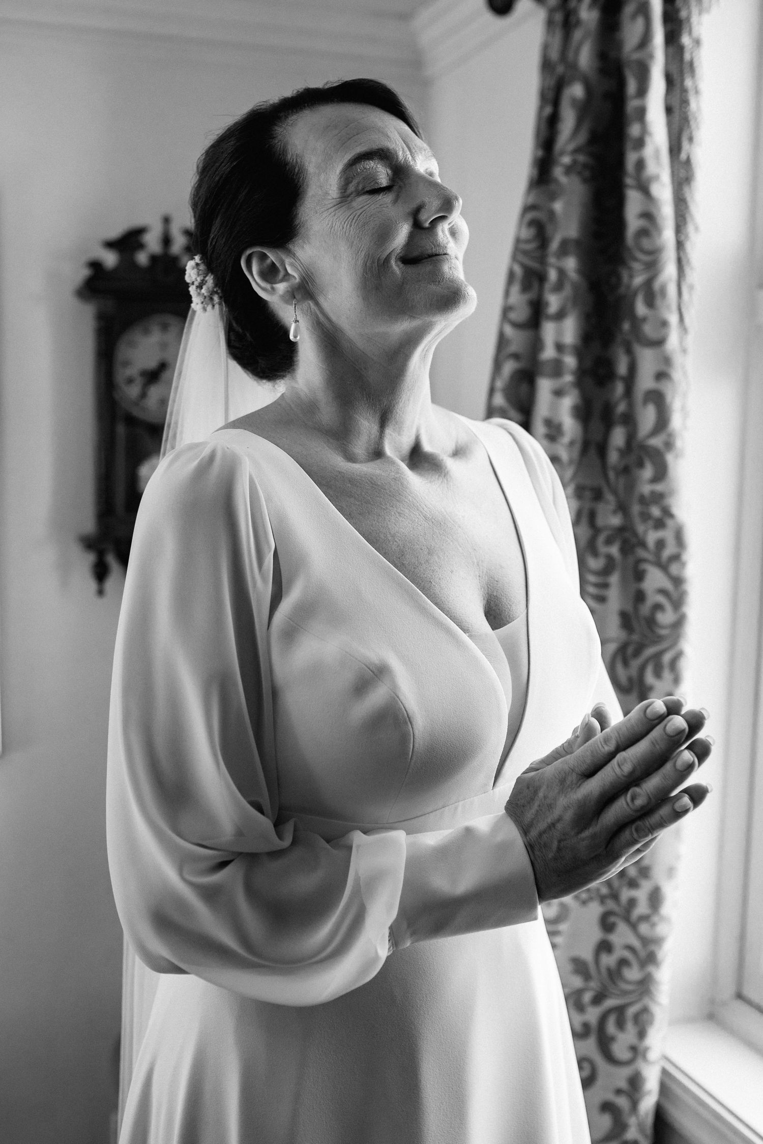 Elegant bridal preparation moments captured in a naturally lit room with classic decor.