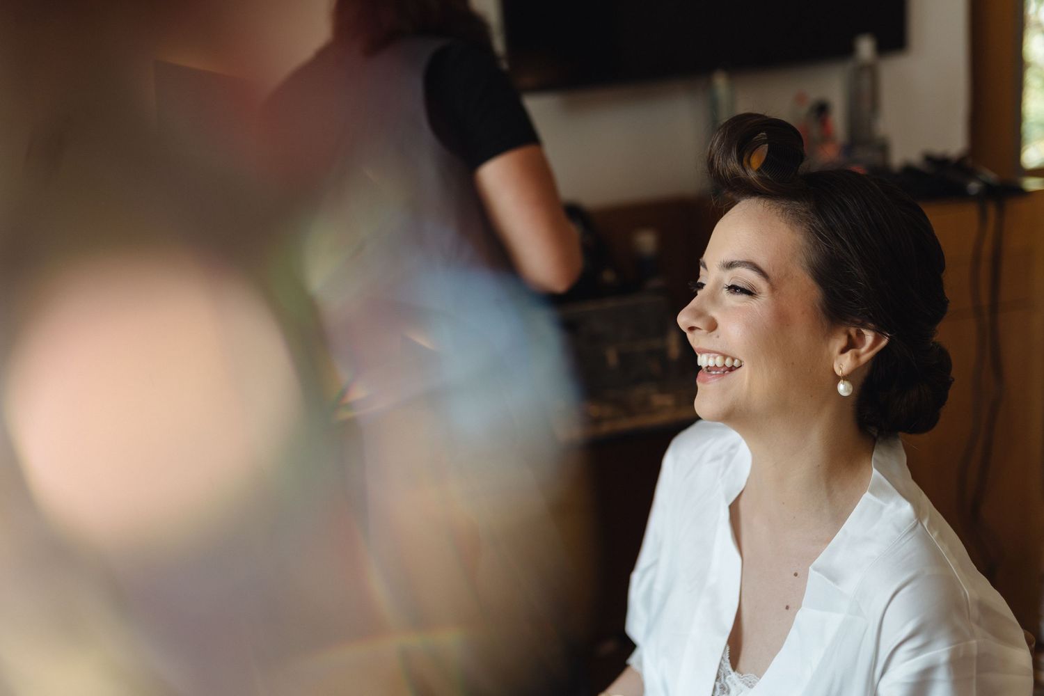 Soft focus images showing wedding day preparations with natural lighting.