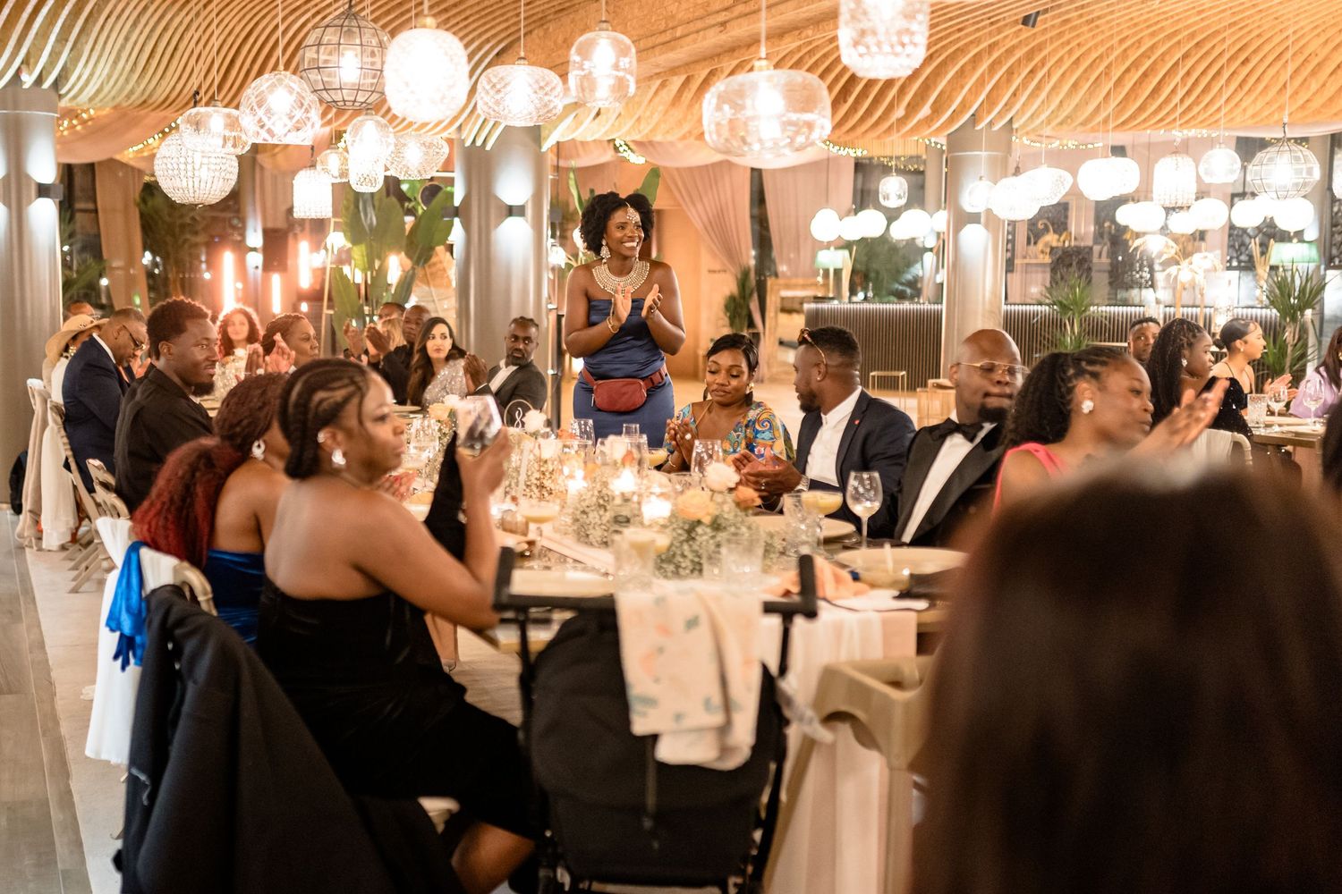 Wedding reception venue with warm lighting and paper lanterns creating an intimate atmosphere.