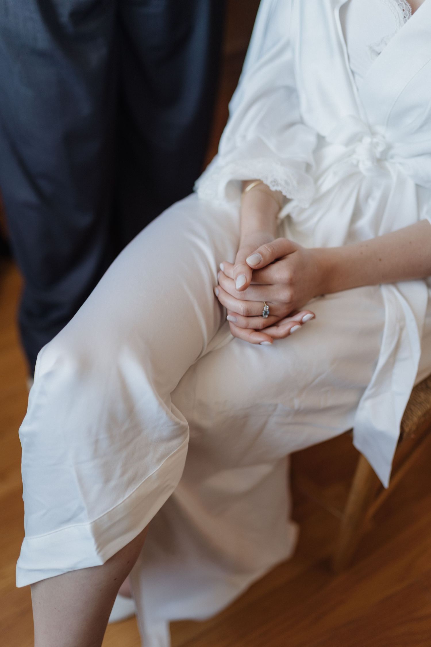 Close-up of white satin fabric folds with elegant draping.