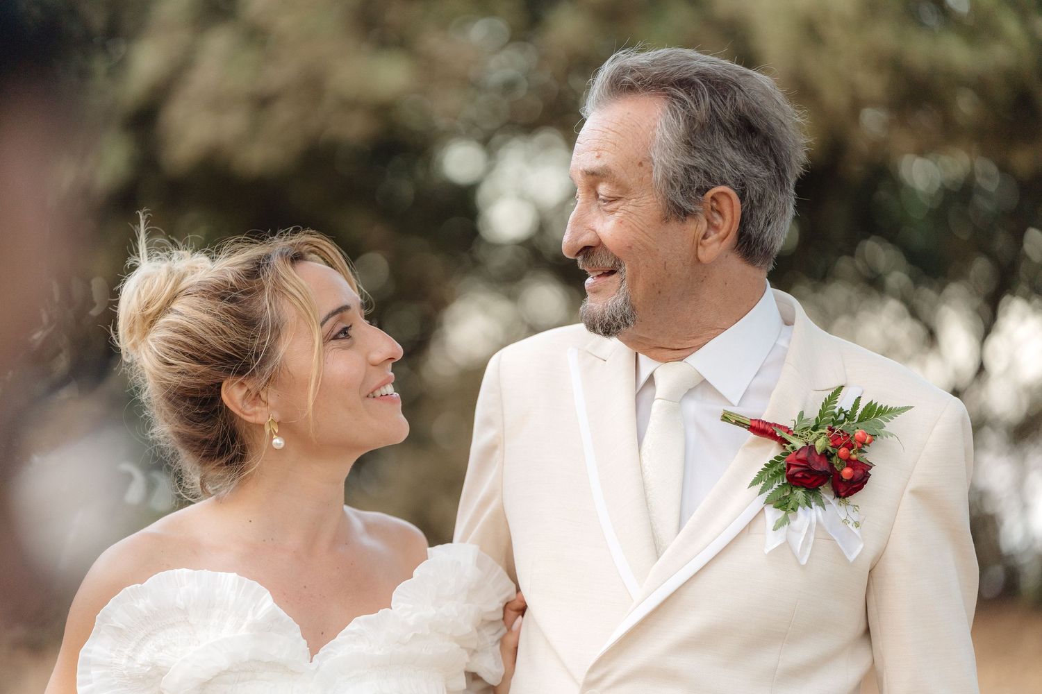 Romantic wedding portraits captured outdoors with elegant styling.