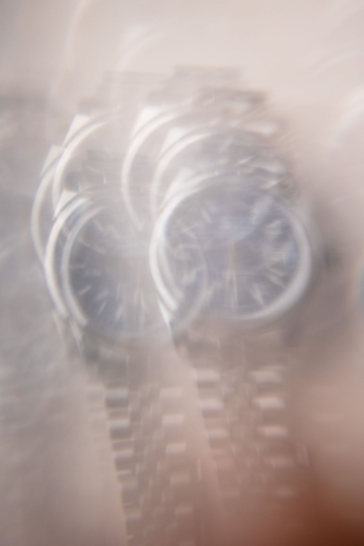 Abstract blurred artistic photography with soft swirling light patterns.