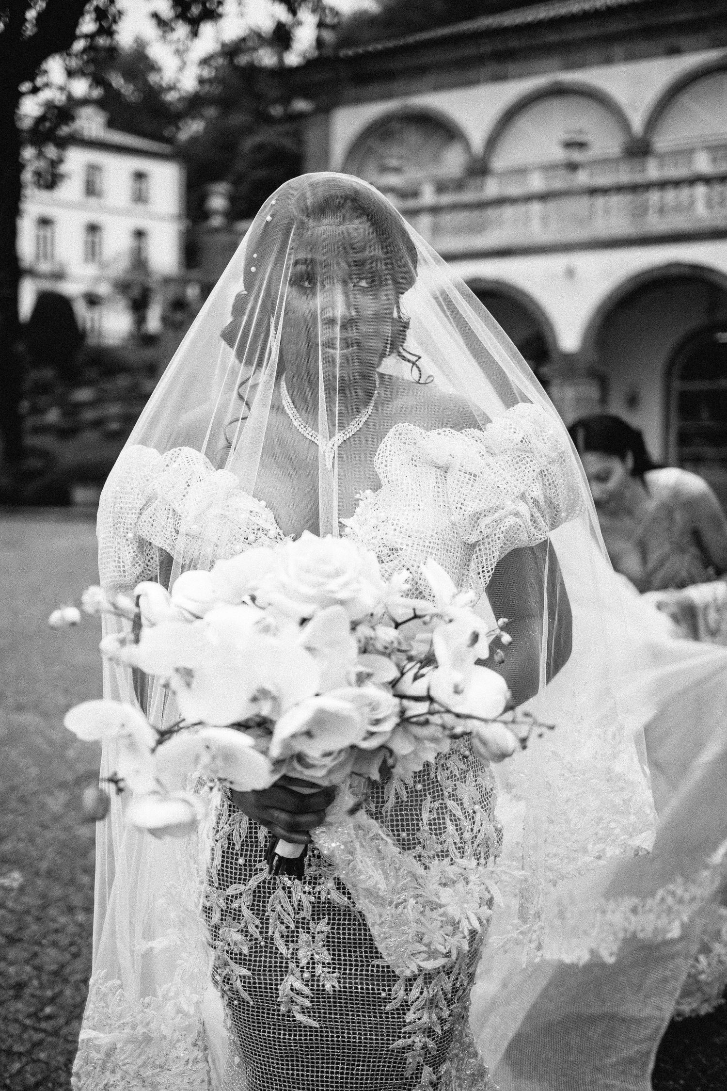 Series of black and white bridal portraits featuring elegant veil and bouquet details.