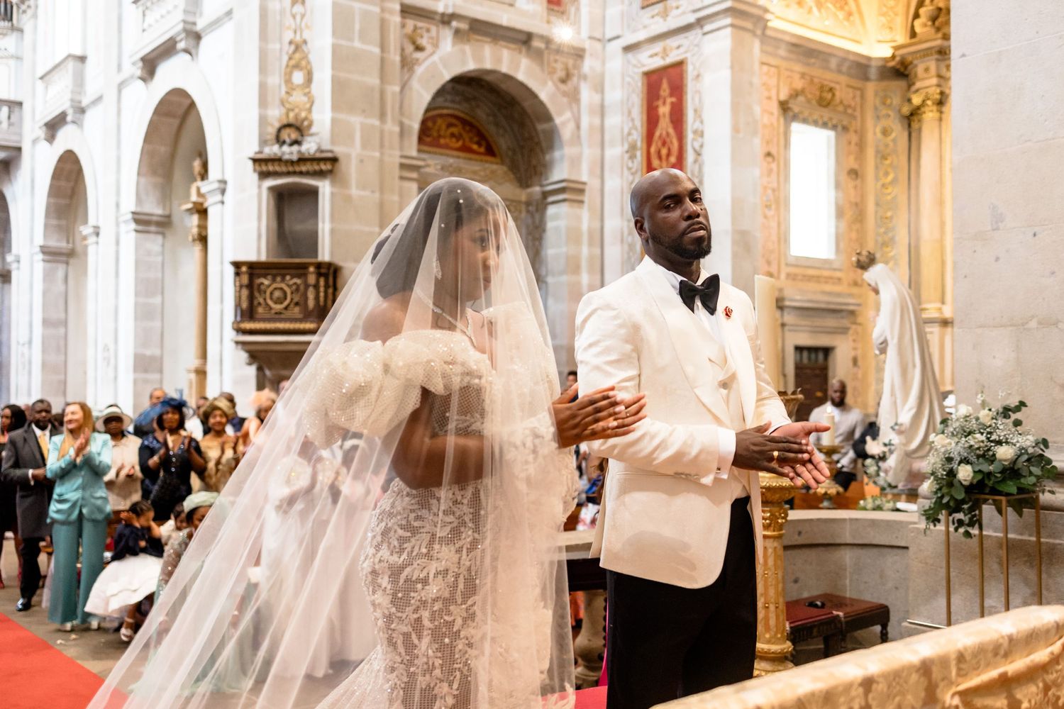A beautiful church wedding ceremony with white decorations and floral arrangements.