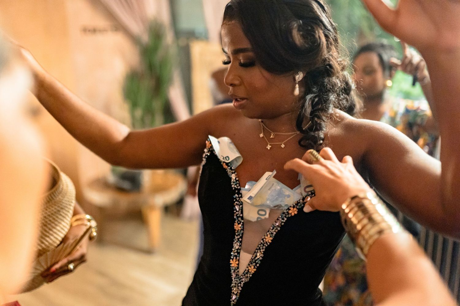 Candid moments from a wedding reception showing guests in elegant attire.