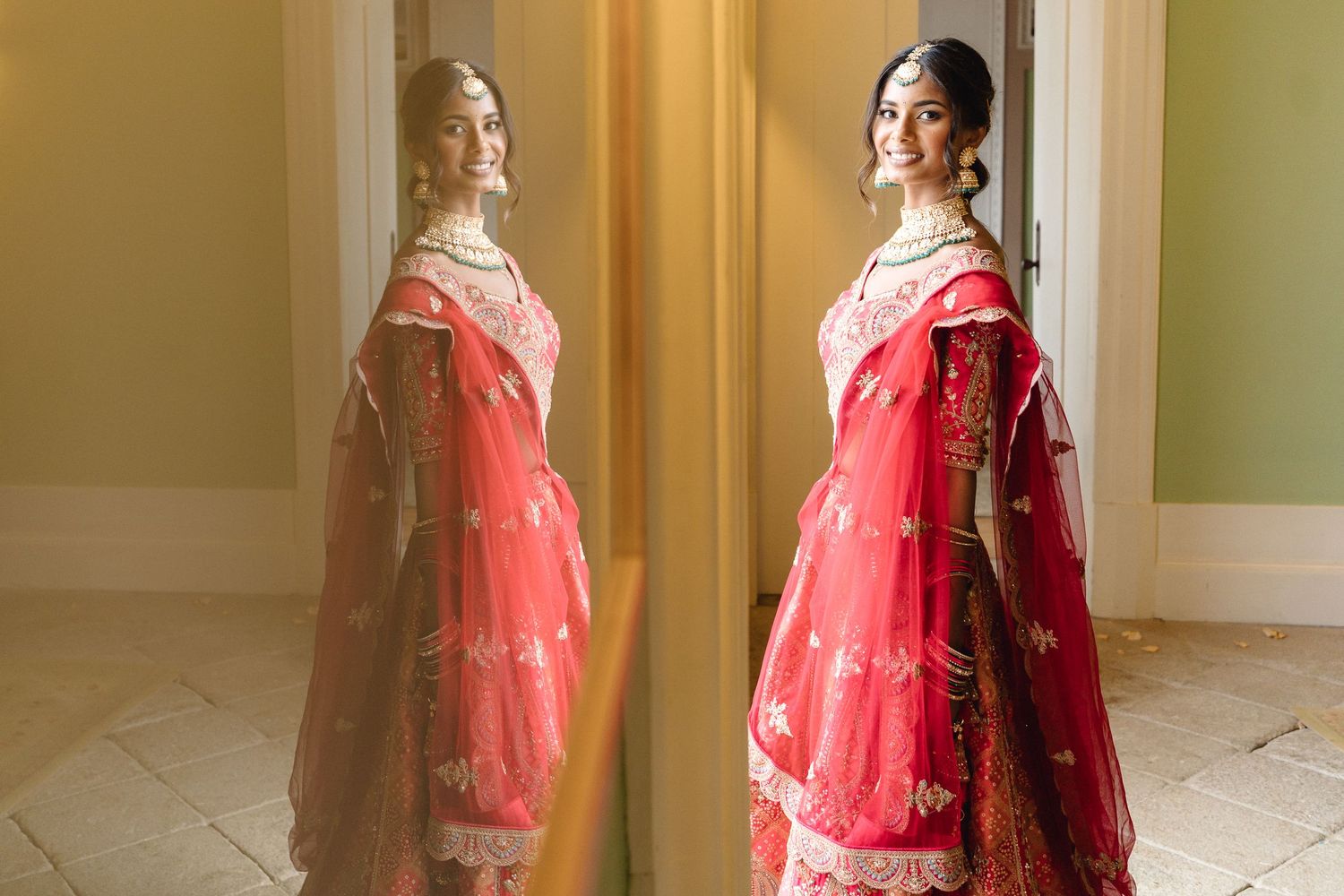 Bride in red lehenga reflected in mirror showing traditional Indian wedding attire.