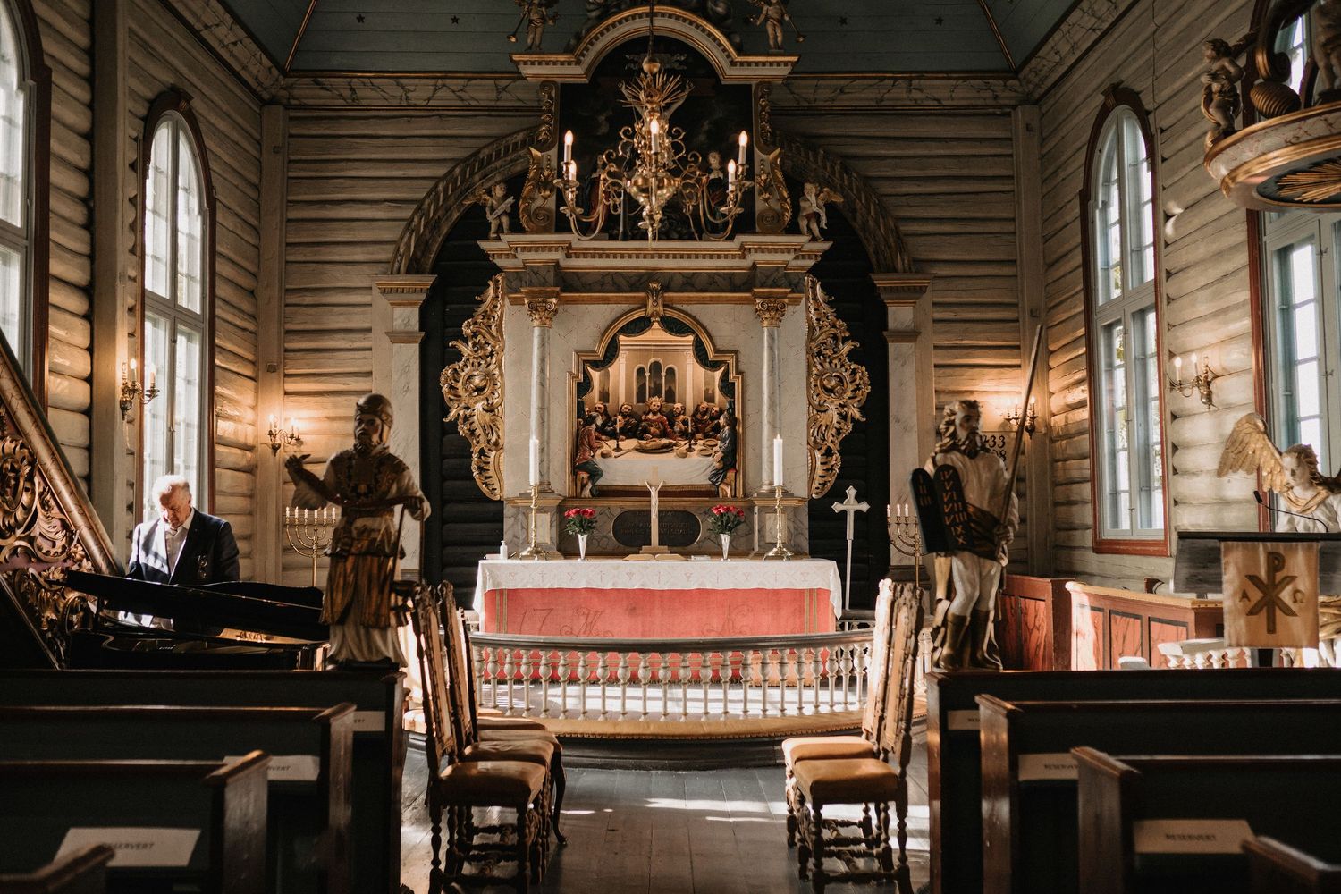 Interior shots of an ornate church sanctuary with elegant architectural details and chandeliers.