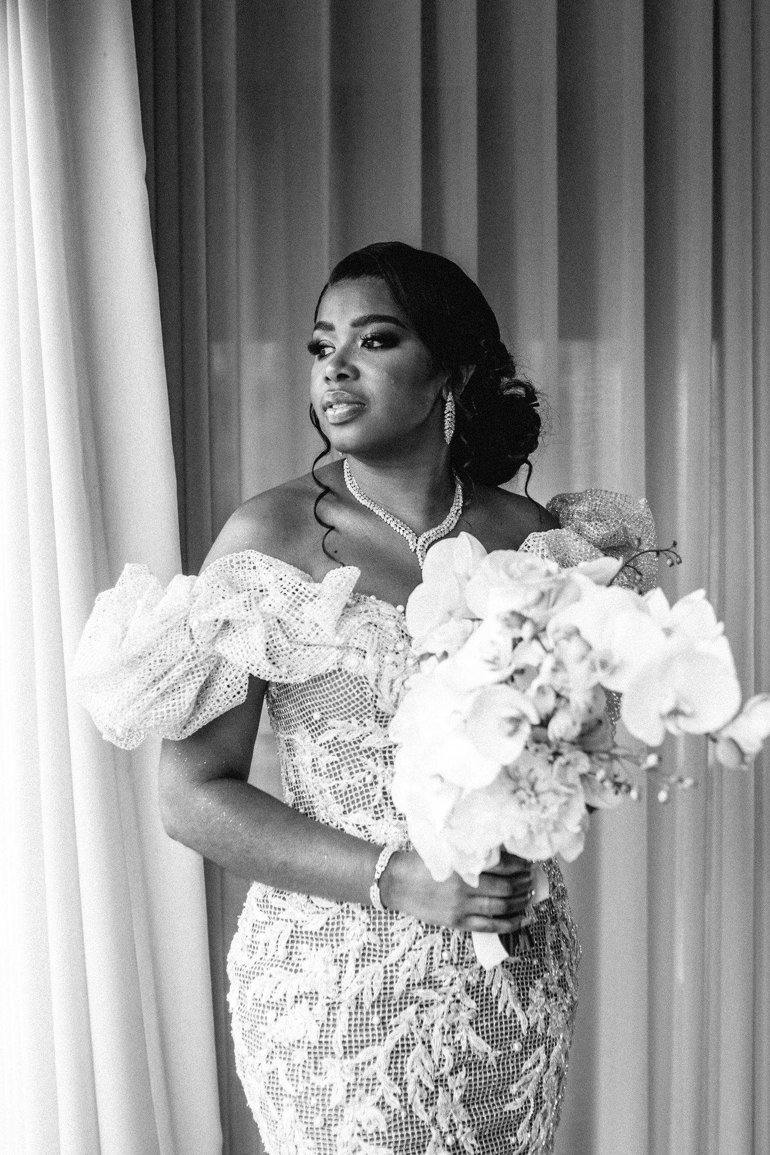 Dramatic bridal portraits with white lace and feather details against a light background.