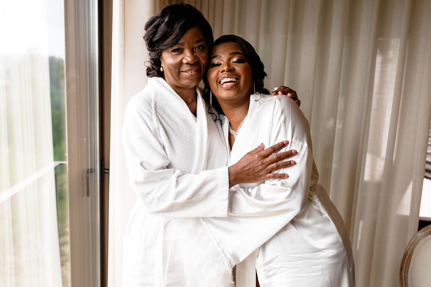 Joyful moments captured during wedding day preparations.