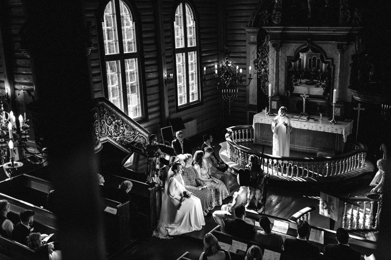 Dark atmospheric wedding reception photos showing venue interior with dramatic window lighting.