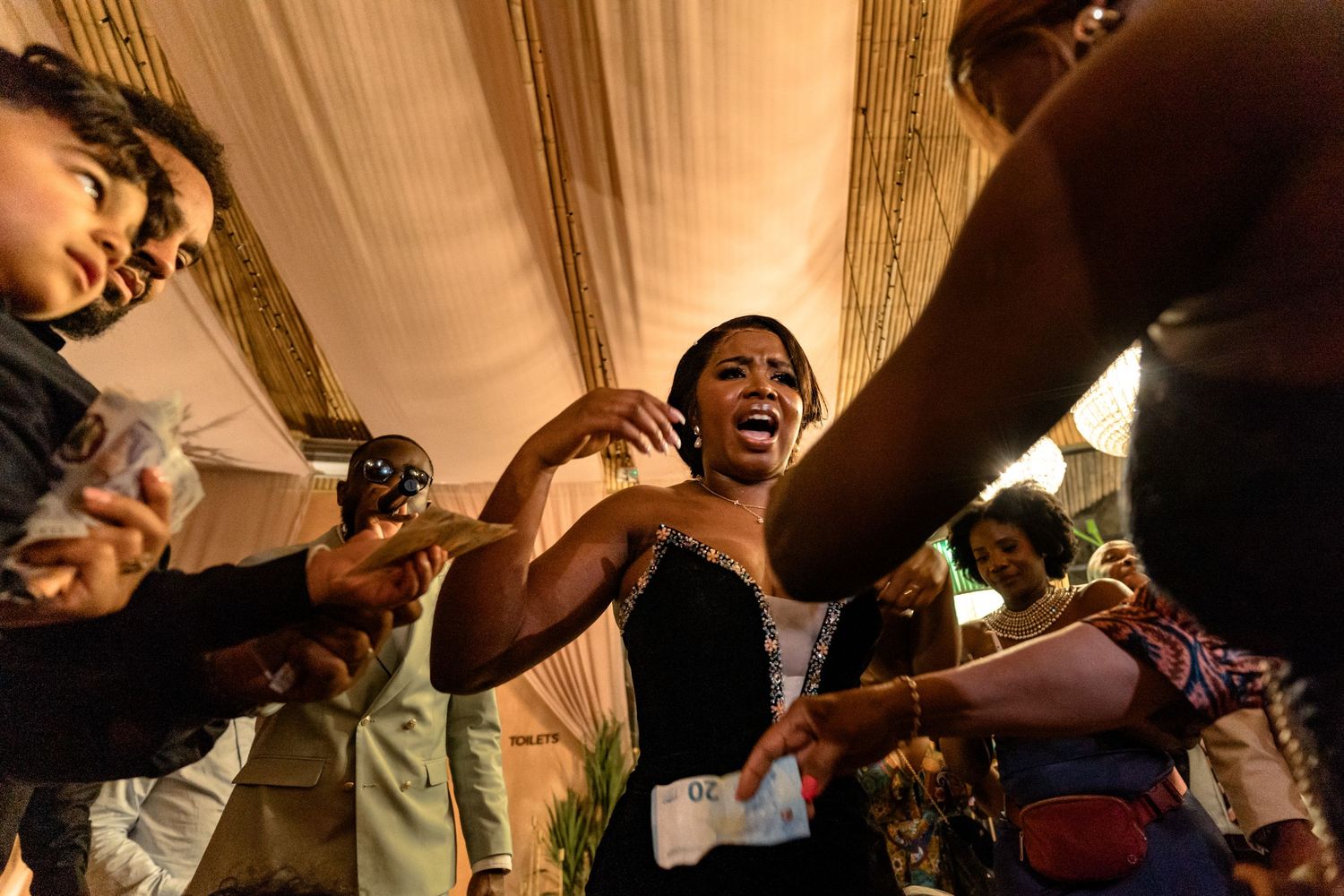 Energetic dance floor moments captured during a joyful wedding reception celebration.