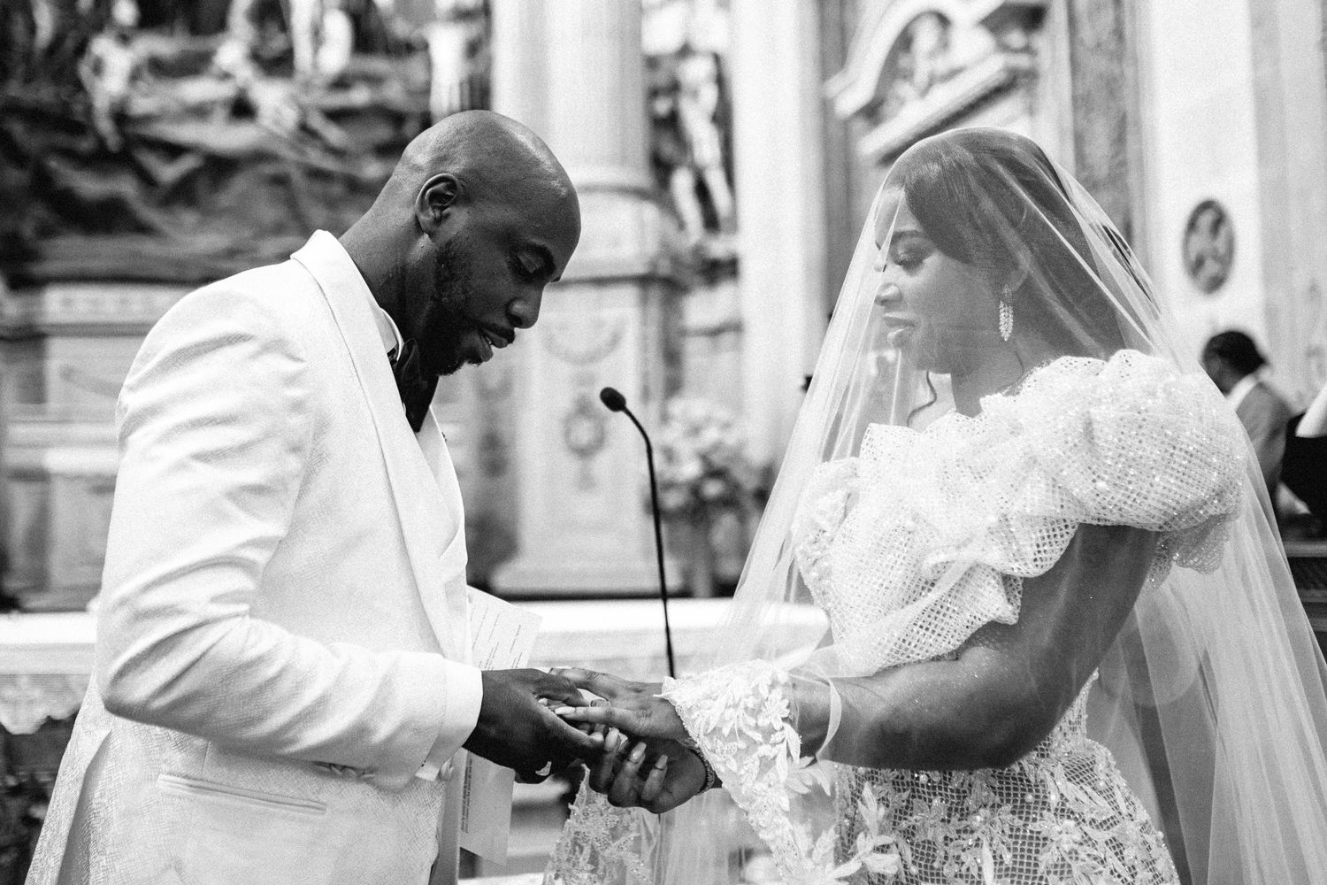 Wedding ceremony moments captured in black and white photography.