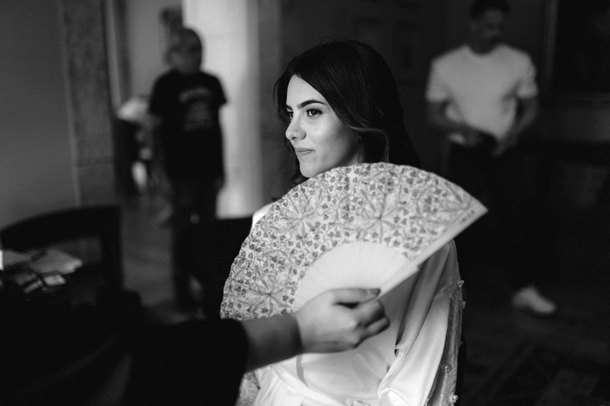 Elegant bridal preparations captured in a series of black and white photographs.