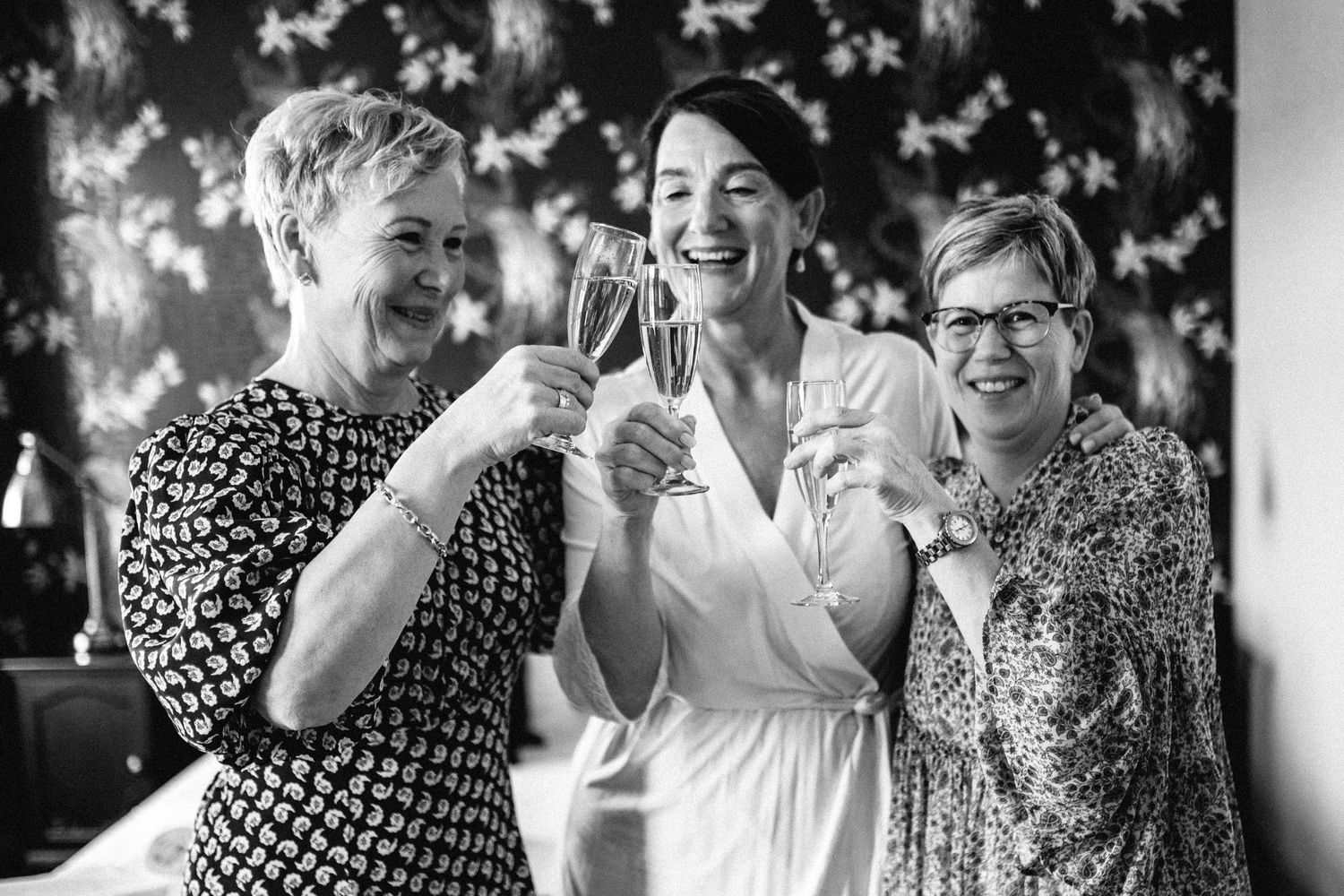Black and white sequence showing people laughing and enjoying a joyful moment together.