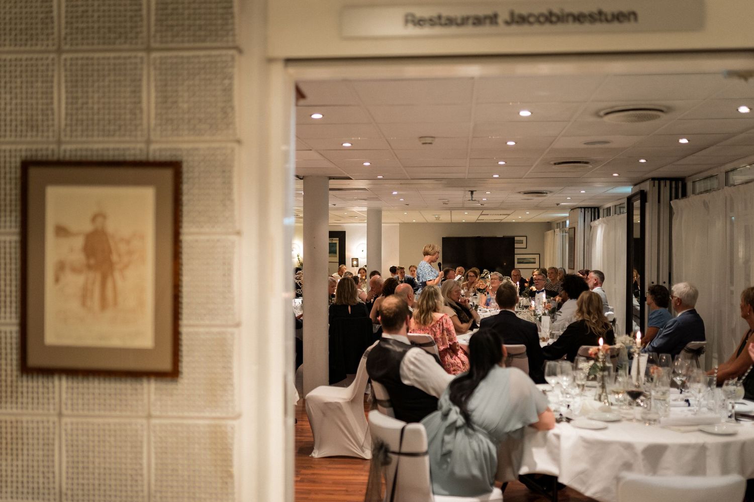 Interior of Restaurant Jacobsenkroken showing dining tables set for a formal event.