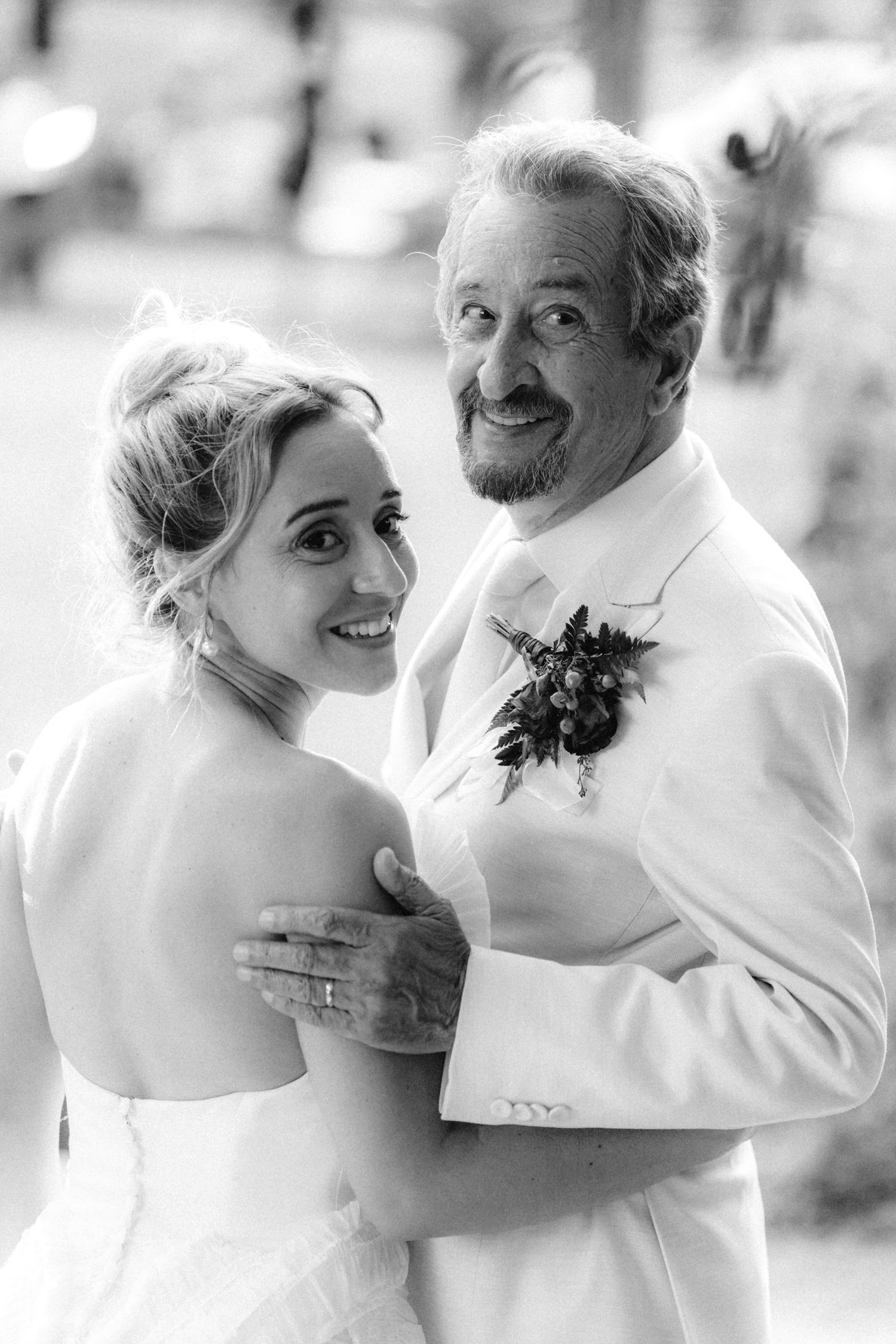 Intimate black and white wedding portraits capture tender moments between newlyweds.
