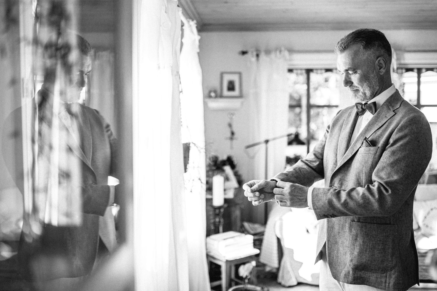 Black and white photos showing people in a rustic interior setting.