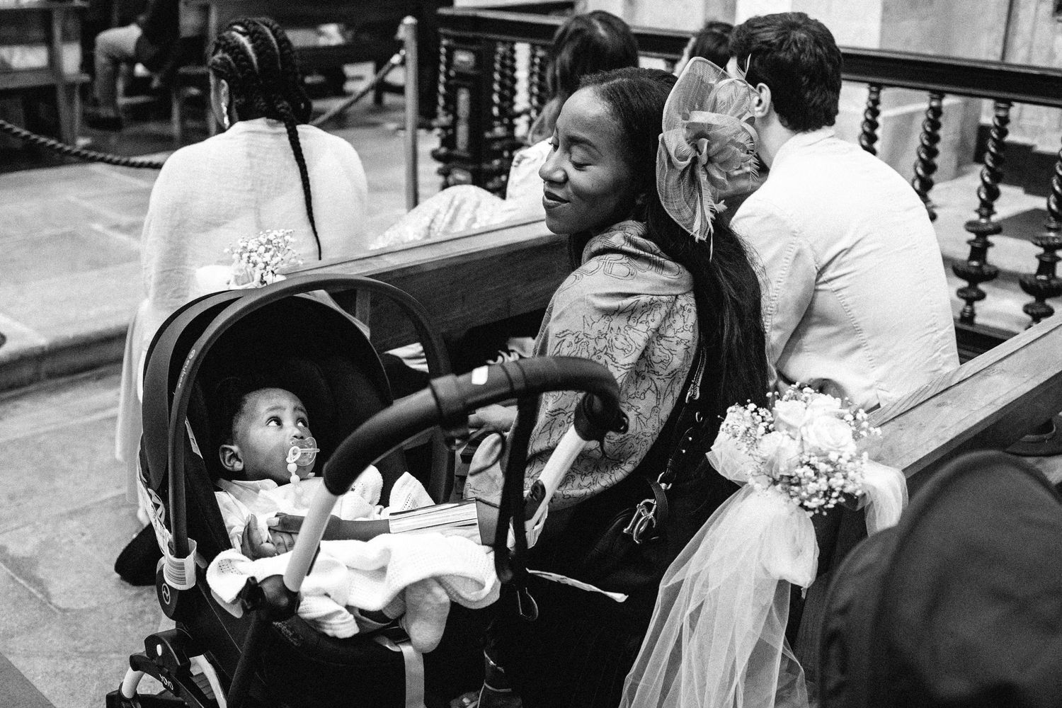 Candid black and white wedding moments captured during ceremony preparations.