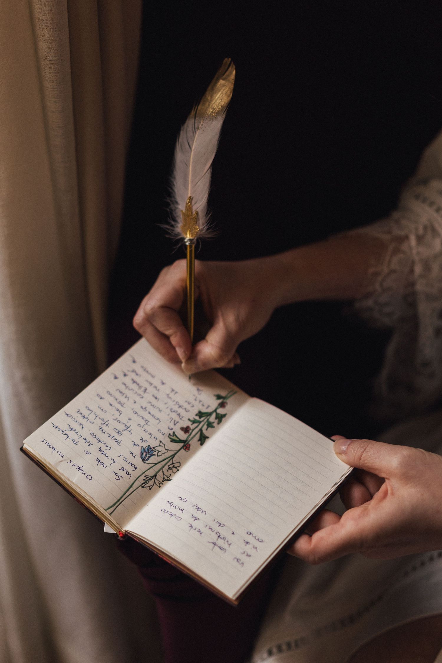 A person writes in a journal with a quill pen in a series of artistic shots.