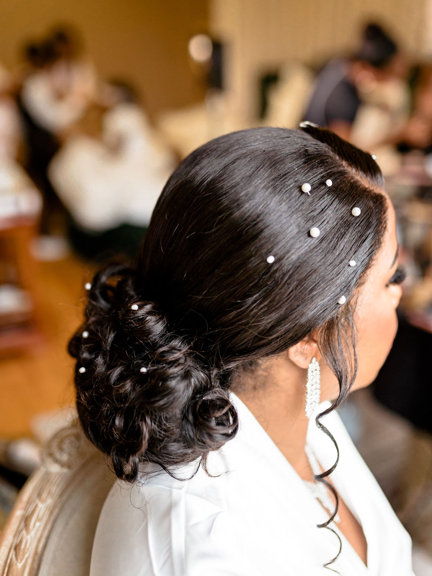 Elegant bridal hairstyle with pearl accessories shown from multiple angles.