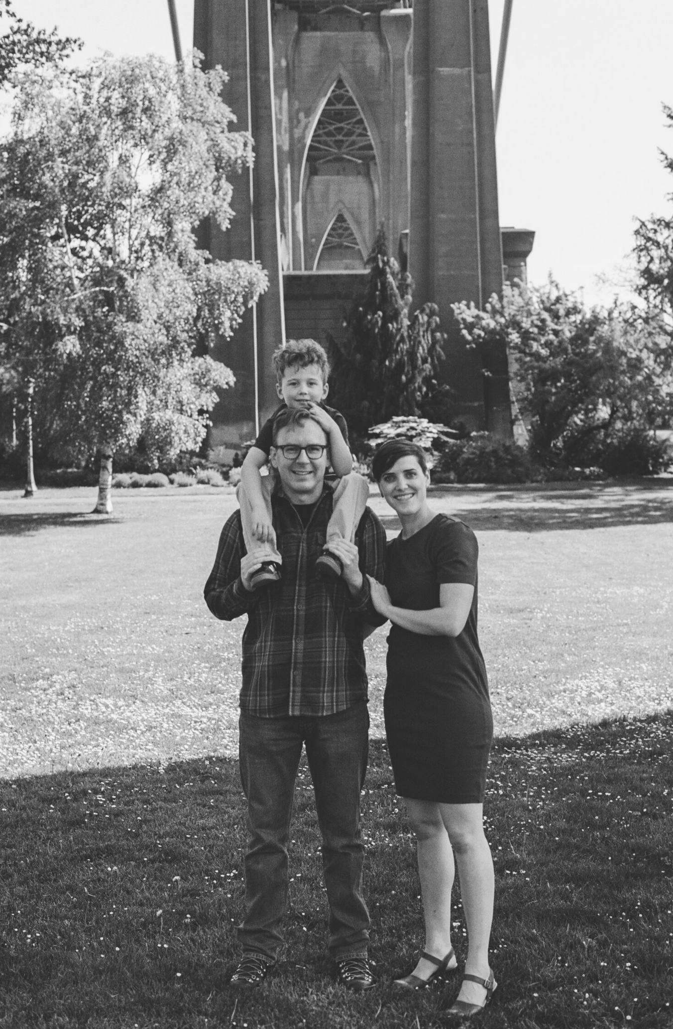 Black and white photos showing people posing playfully outside a church or cathedral.