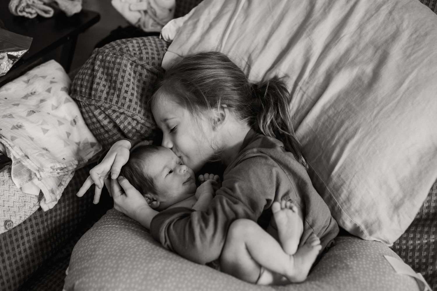 An intimate black and white photograph showing tender moments of rest.