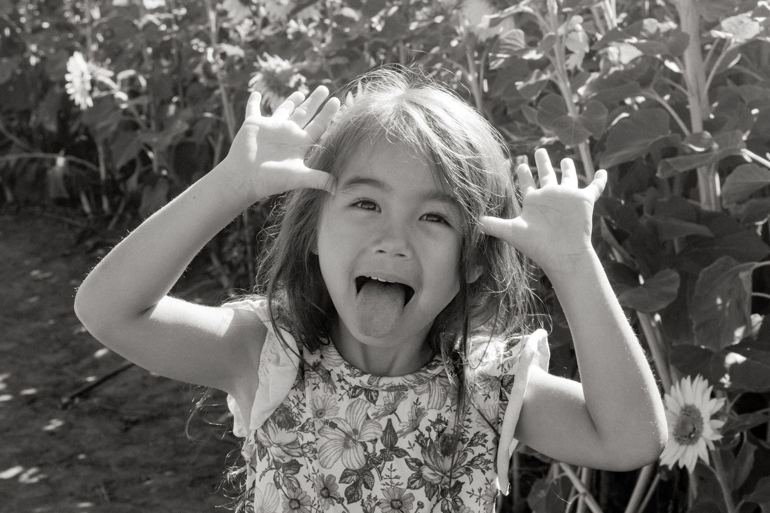 A playful sequence shows someone making silly faces and gestures while enjoying time outdoors in nature.