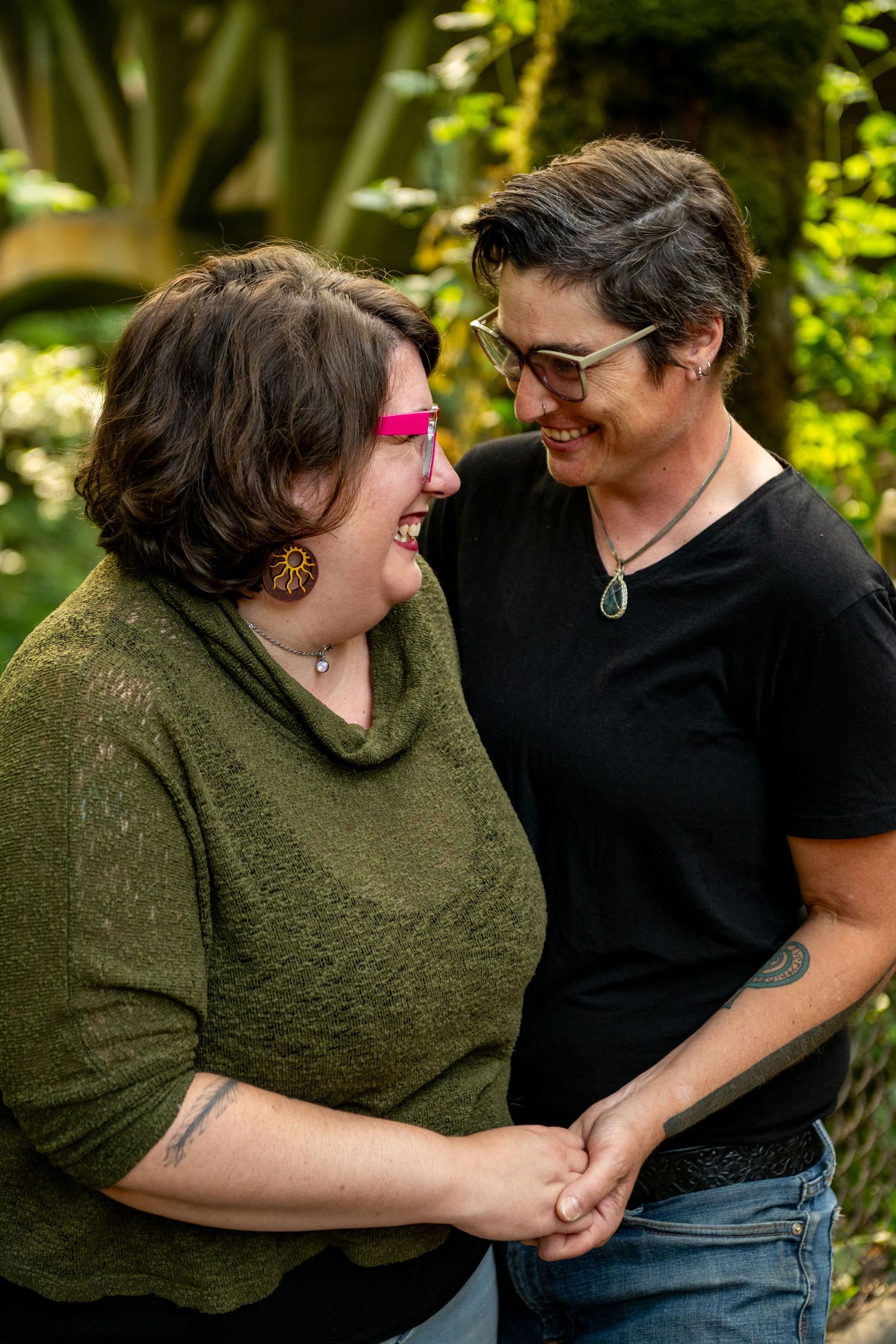 A playful sequence of candid outdoor photos showing two people in casual wear laughing and embracing in a garden setting.
