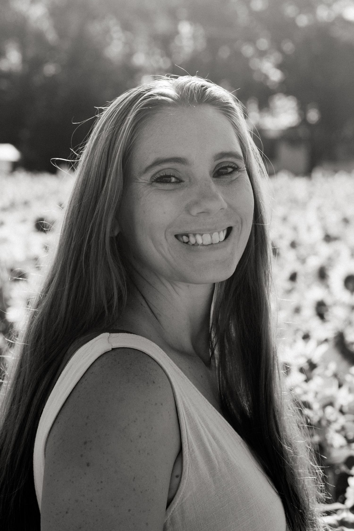 Black and white portrait series showing progressive expressions in a cotton field setting.