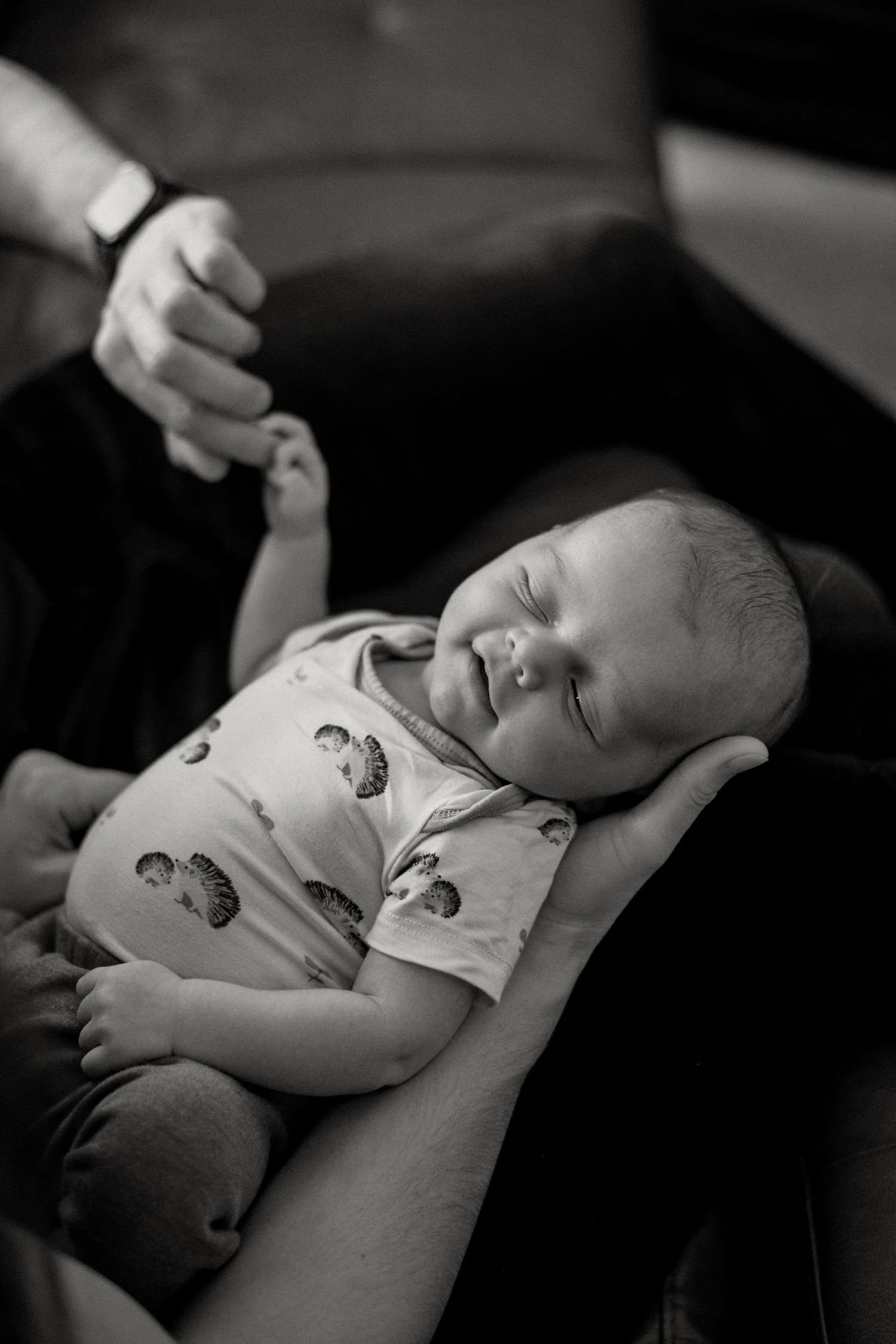 Black and white series showing peaceful sleeping infant.