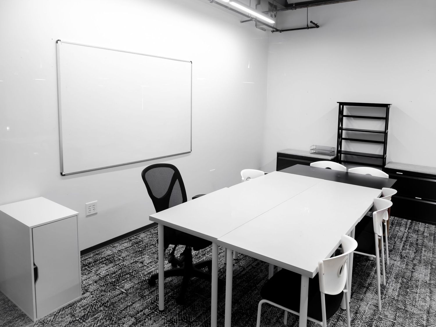 Commercial real estate photography of a clean, minimalist corporate meeting room and modern office space in Metro Atlanta, GA.