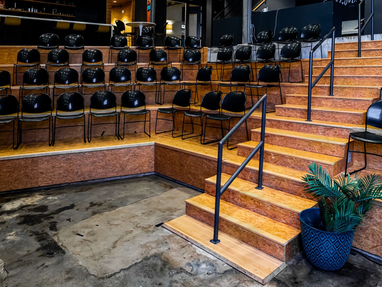 Architectural interior photography highlighting an empty modern auditorium and presentation venue in Atlanta, GA.