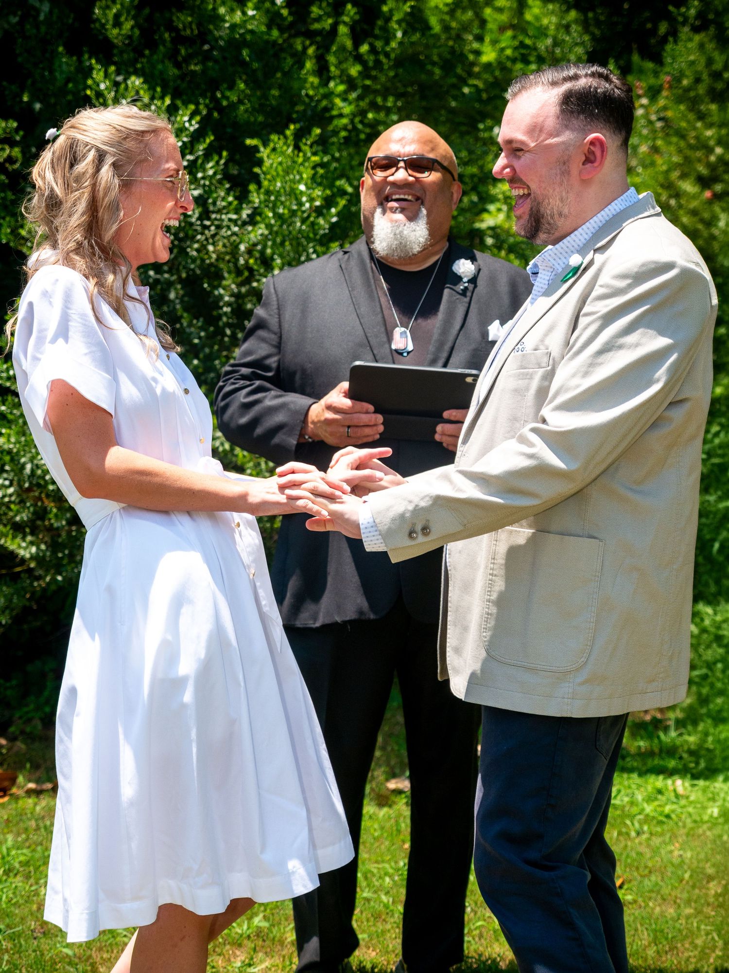 Candid event photography of an outdoor milestone wedding ceremony and couple exchanging vows.