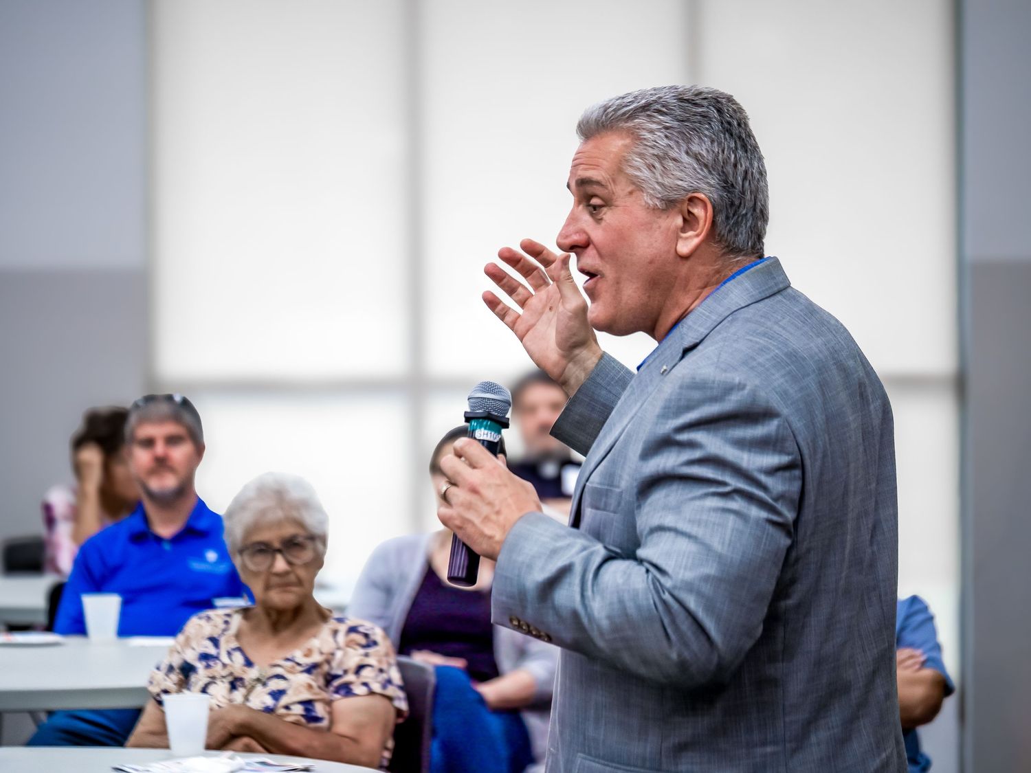 Keynote speaker engaging with the audience during a corporate seminar photographed in Warner Robins GA.