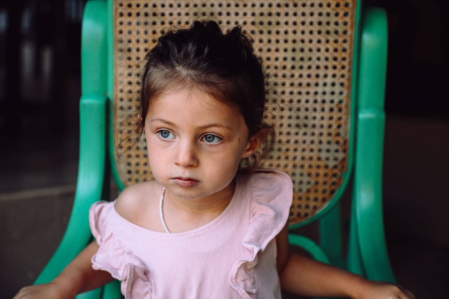 Young girl in pink outfit sitting outdoors, Sydney family photography