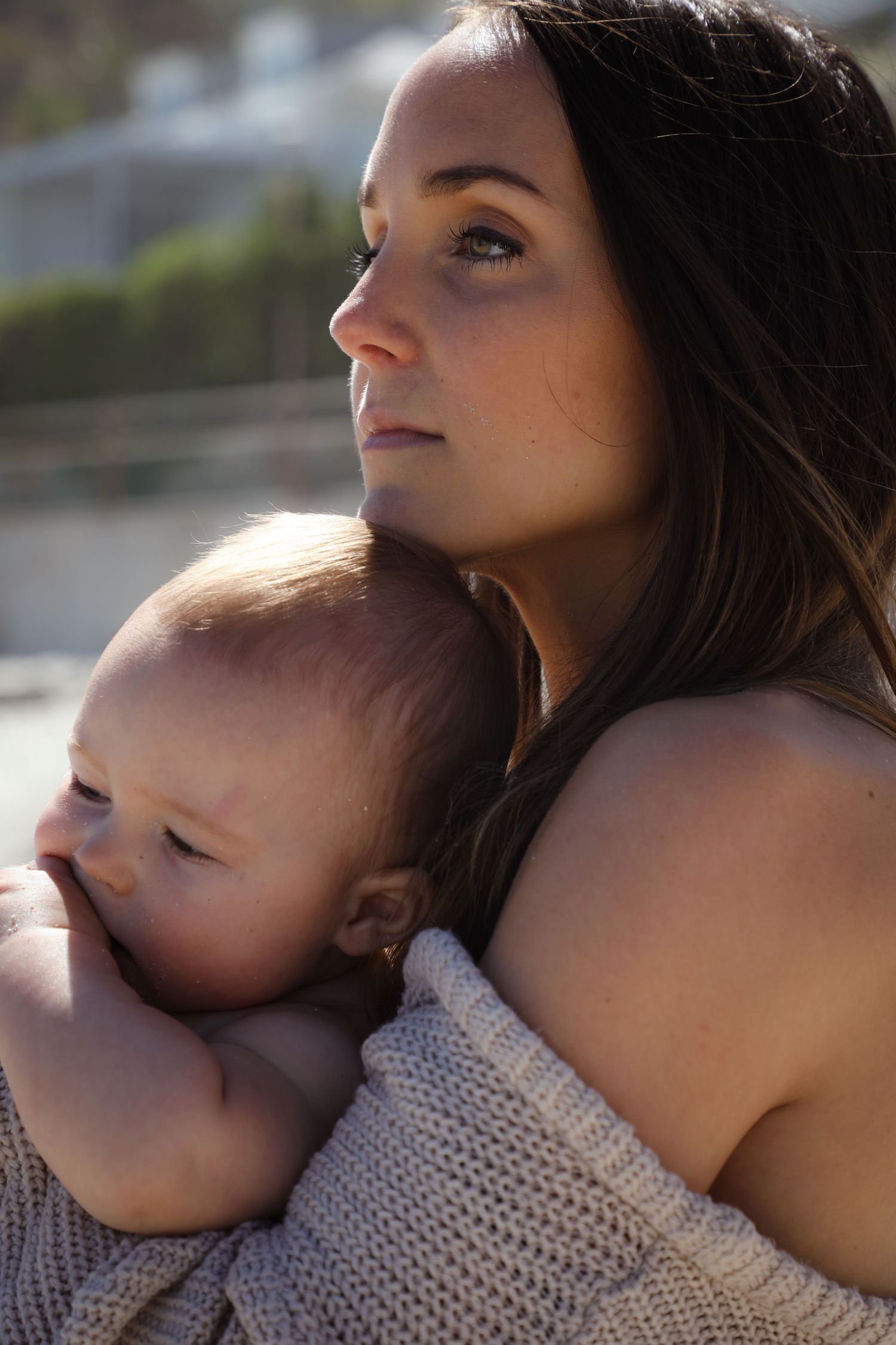 Profile portrait of woman in natural light holding her baby, Sydney lifestyle photography