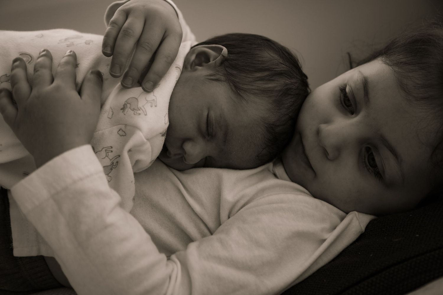 Sibling and newborn baby sleeping close together, Sydney newborn photography