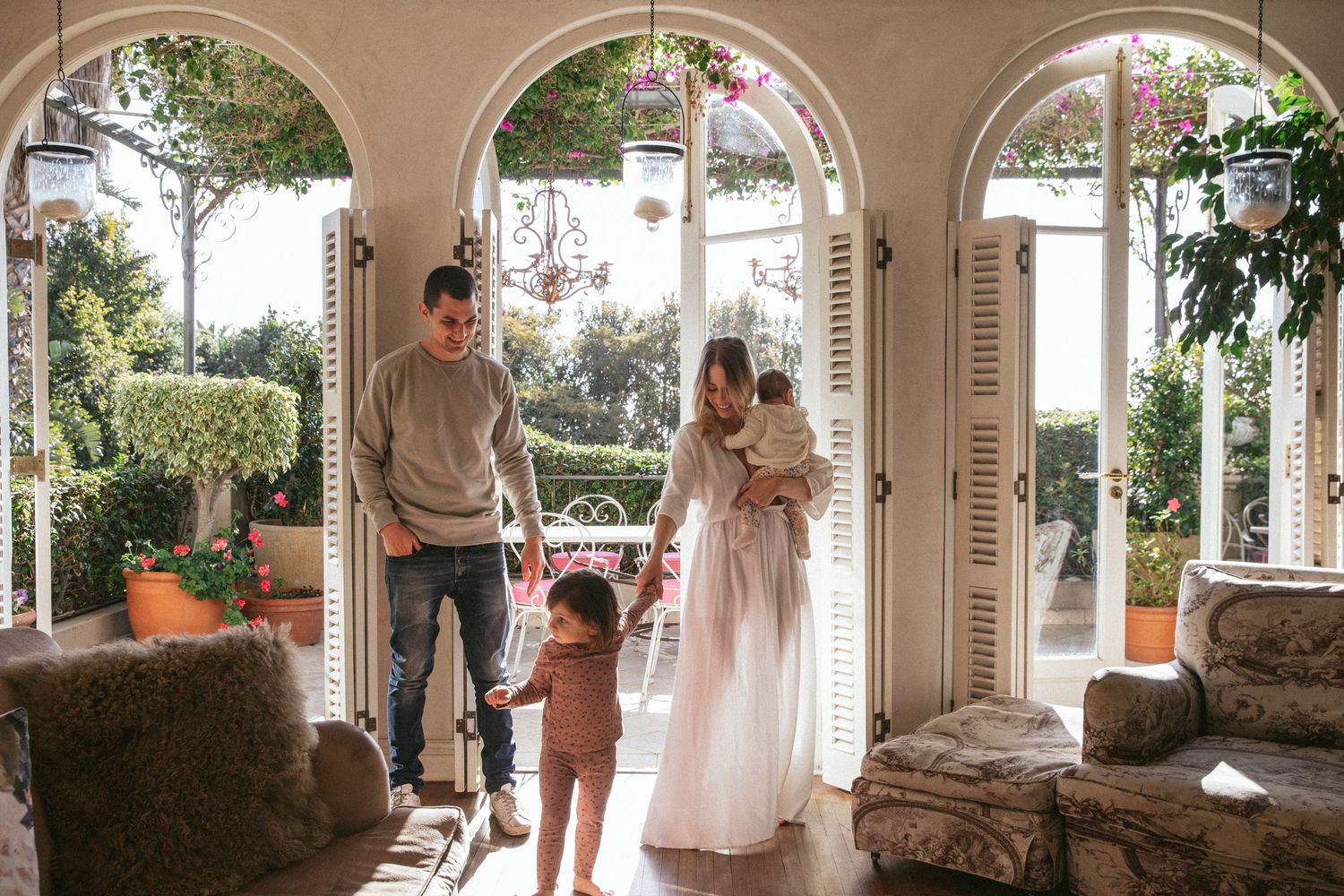 Family standing together in archway courtyard setting, Sydney family photography