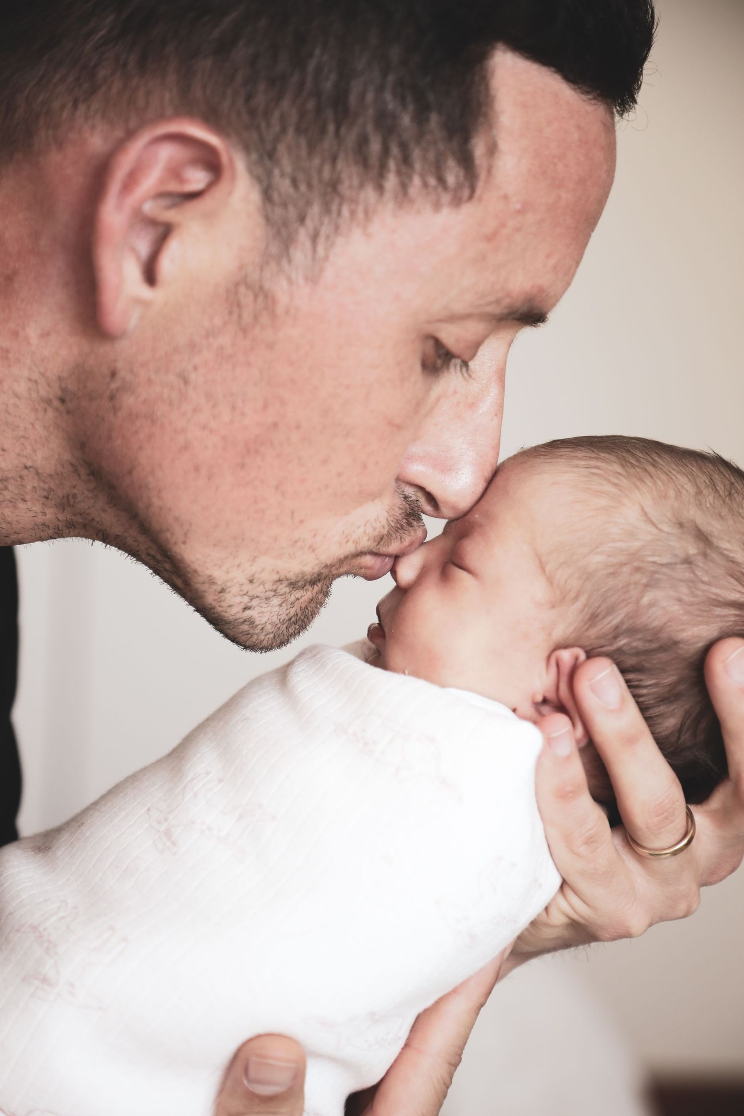 Father and baby sharing close moment, forehead to forehead, Sydney family photography