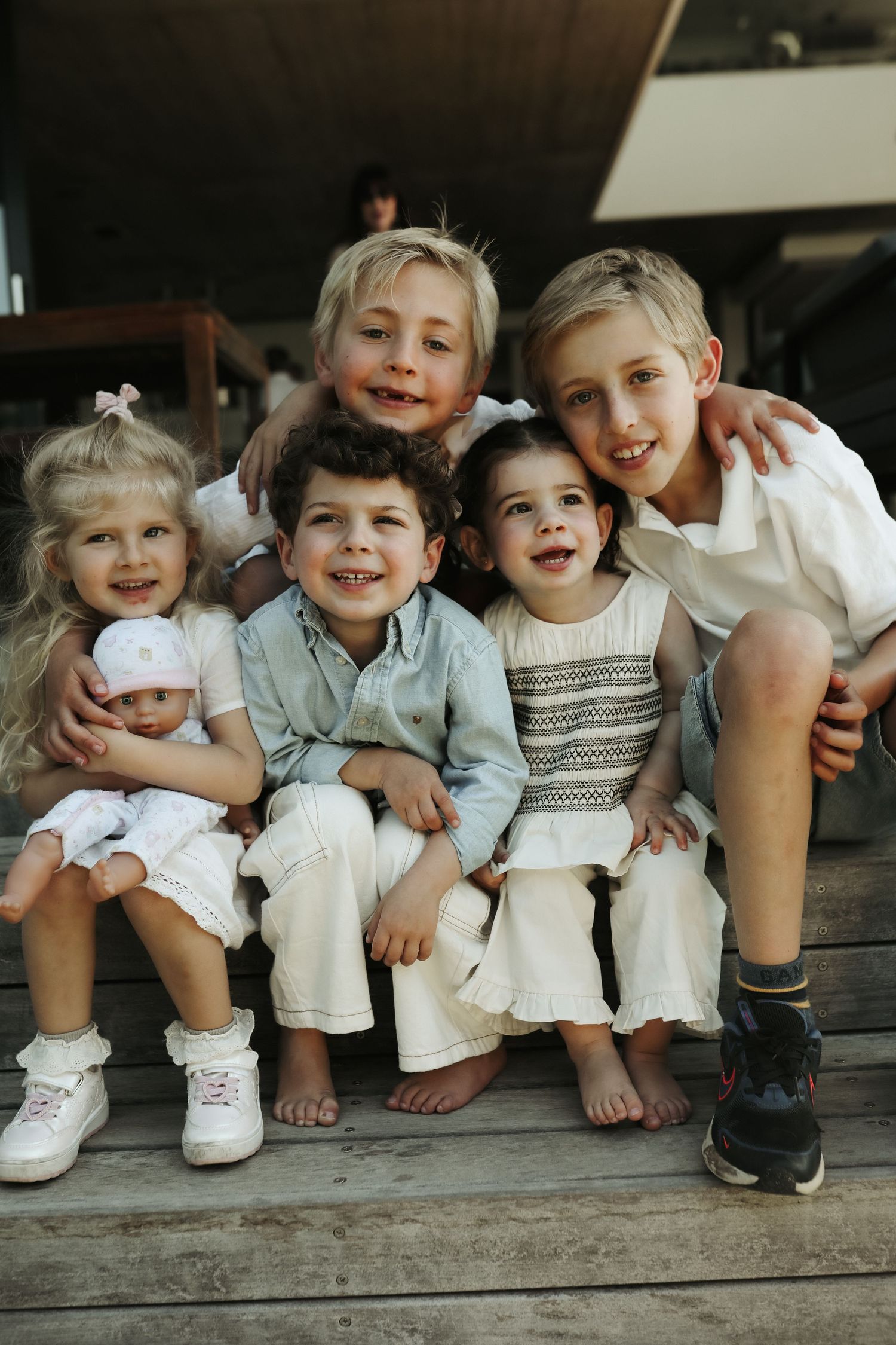 Large family group portrait outdoors on wooden steps, Sydney family photography