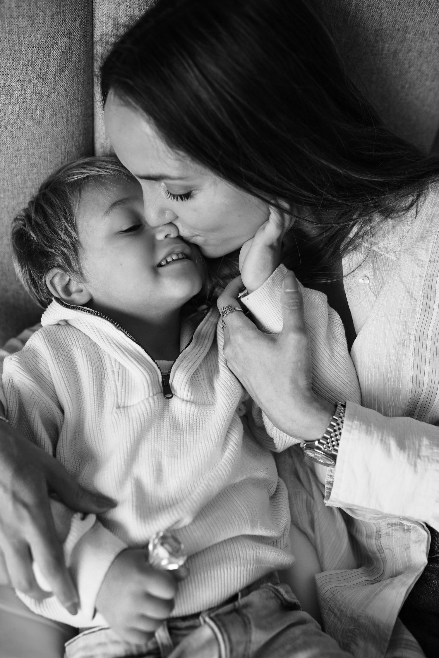 Black and white portrait of mother kissing toddler's cheek, Sydney family photograph