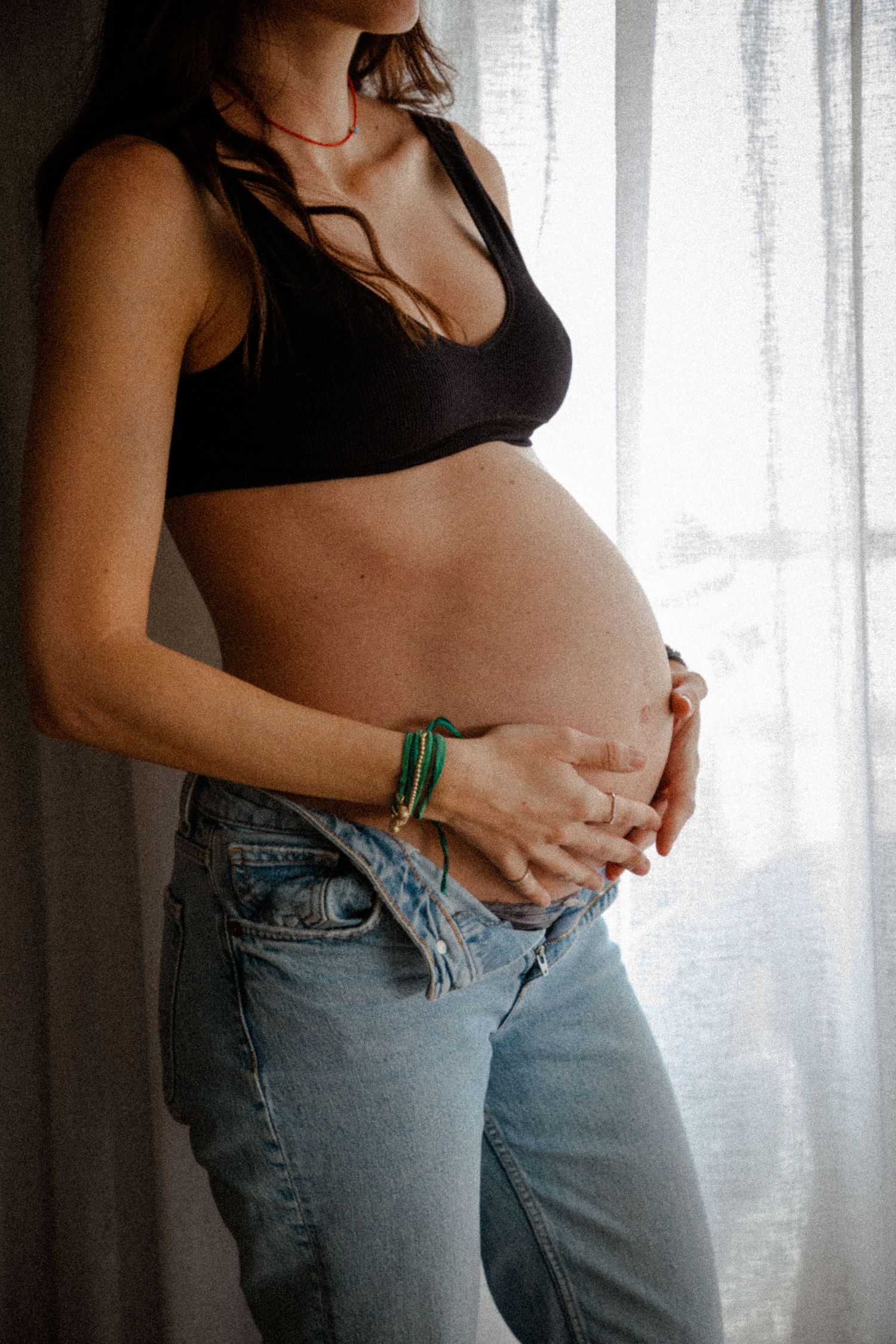 Maternity portrait of pregnant woman in natural window light, Sydney