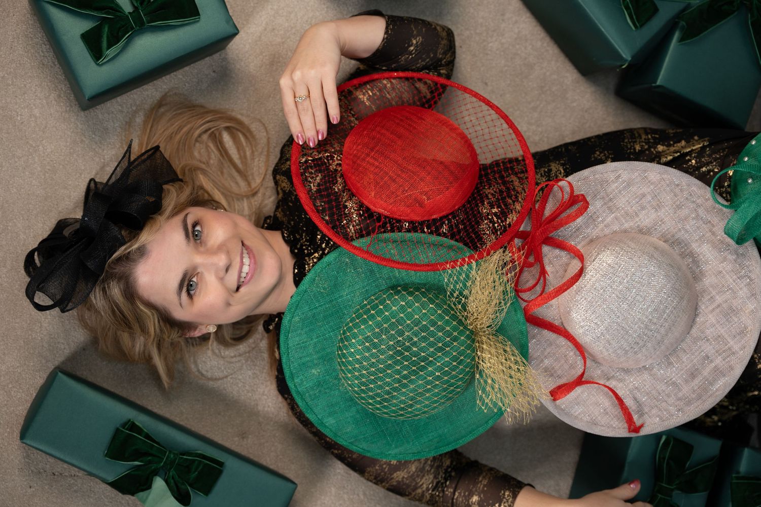 Festive flat lay portrait with fascinator hats and wrapped gifts, Christmas photography by Anya MacLaren